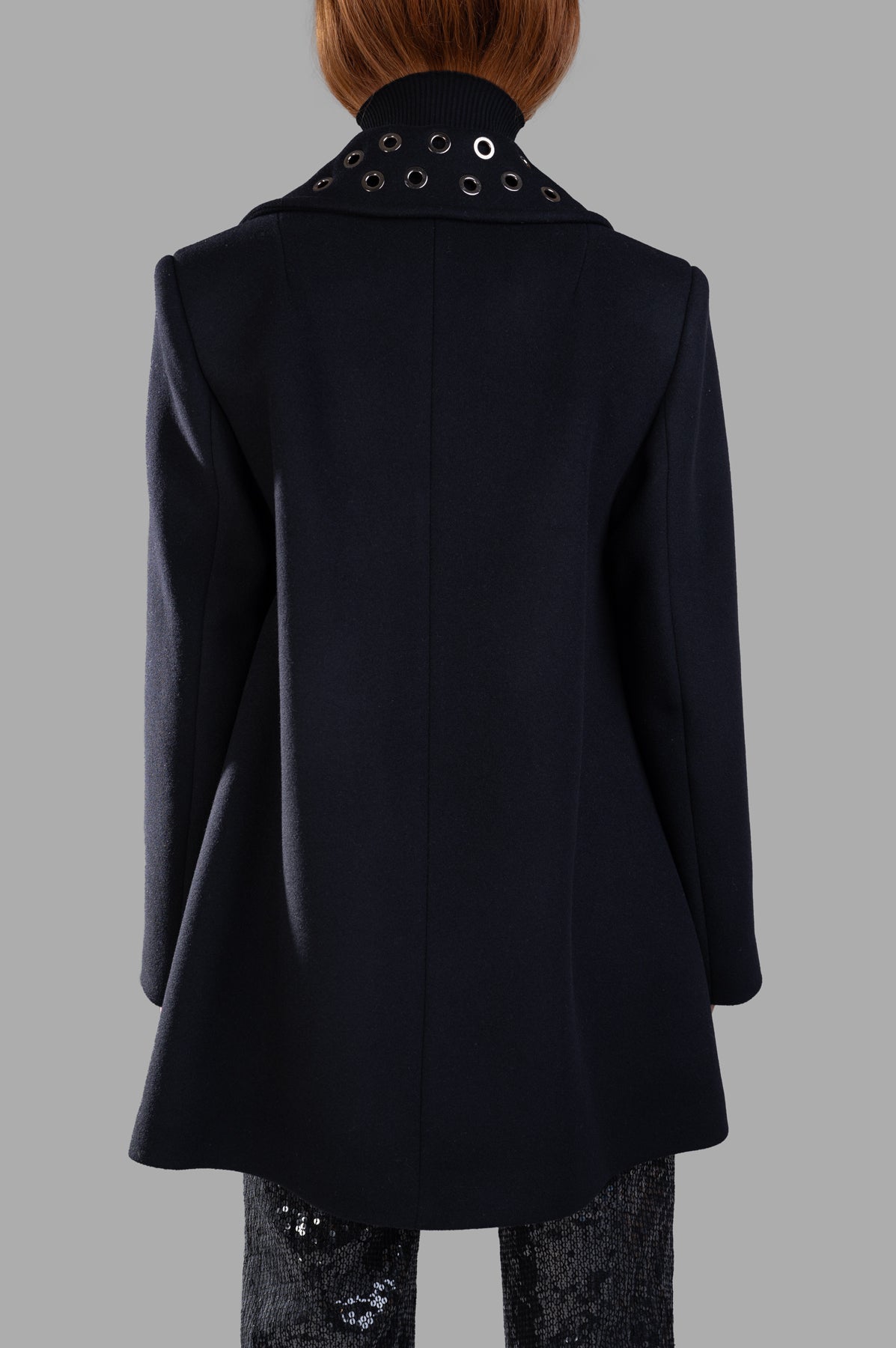 MSGM Double-breasted Coat displayed from the back, showcasing the boxy silhouette and distinctive grommeted collar detail.