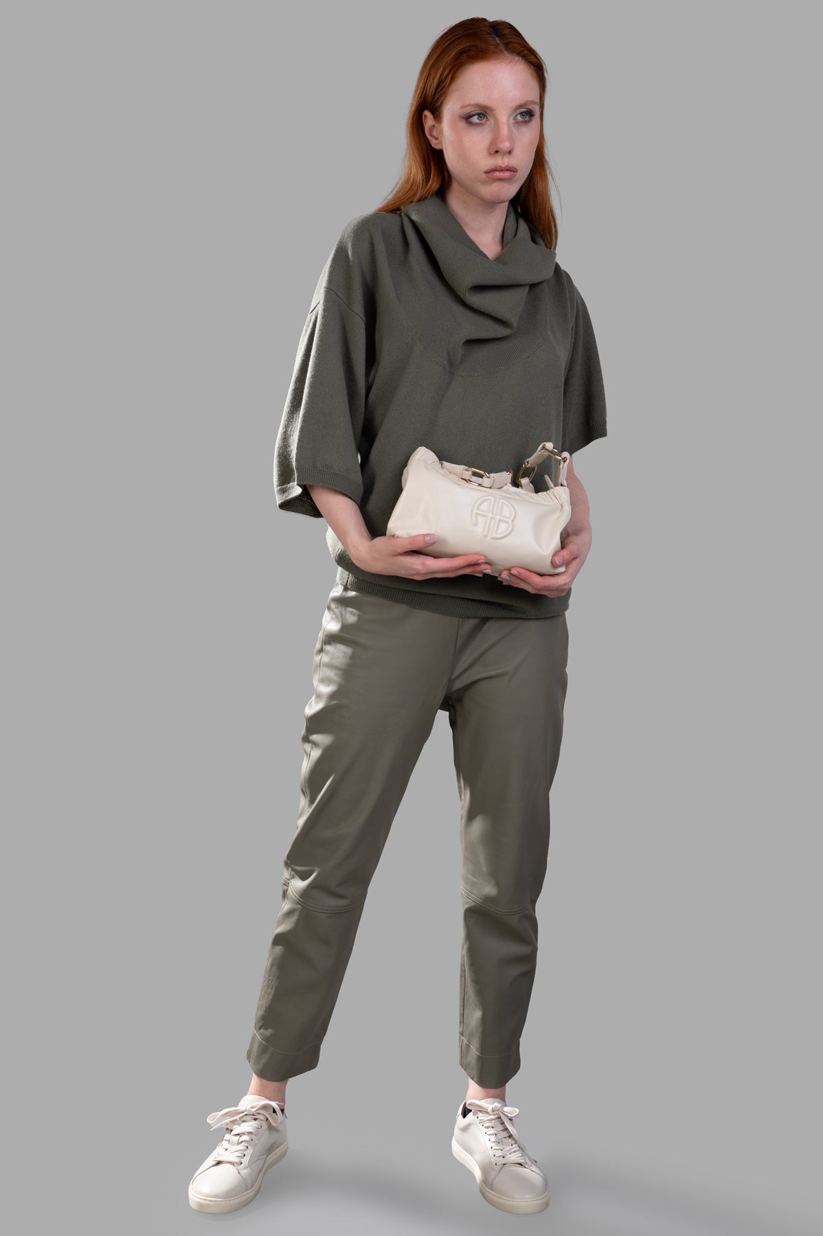 Gentry Portofino Cropped Leather Pants in olive green, showcased on-model front view, highlighting high-waist, stylish fit.