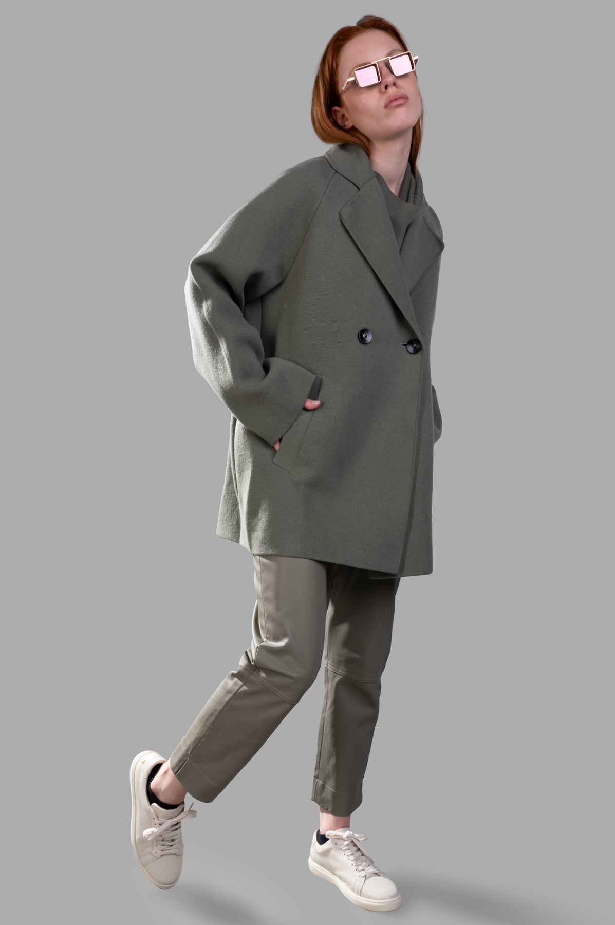 Gentry Portofino Olive Double-breasted Coat on model, showcasing oversized fit and wide lapels.