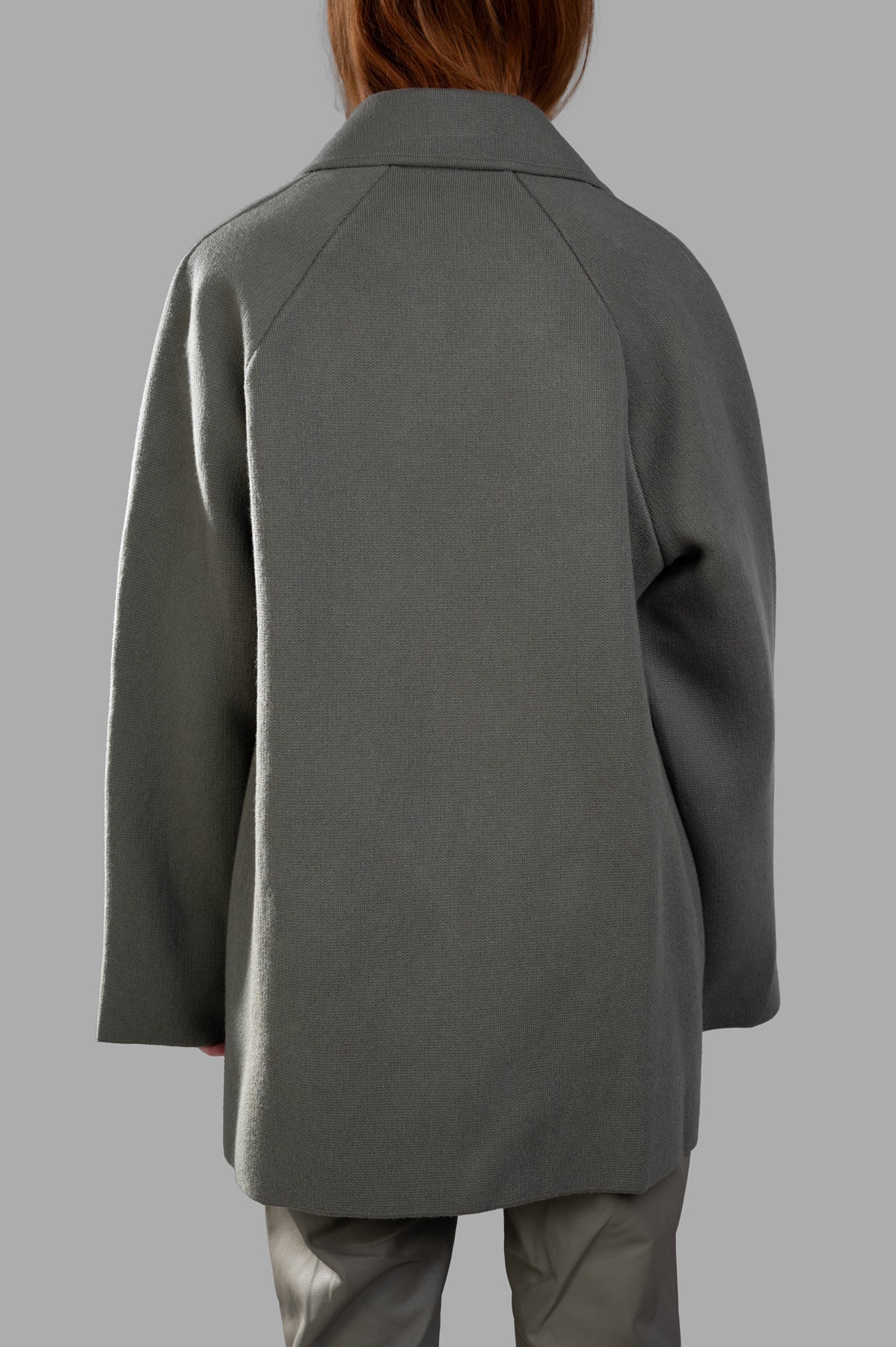 Gentry Portofino Olive Double-breasted Coat displayed from the back, showcasing its oversized fit and textured fabric.