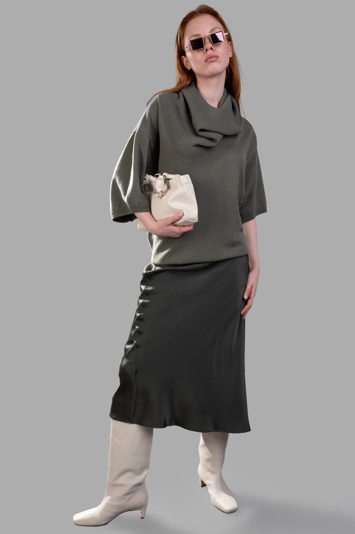 Gentry Portofino Olive Sweater on model, showcasing slouchy fit with shawl neckline in olive green cashmere, 3/4 sleeves.
