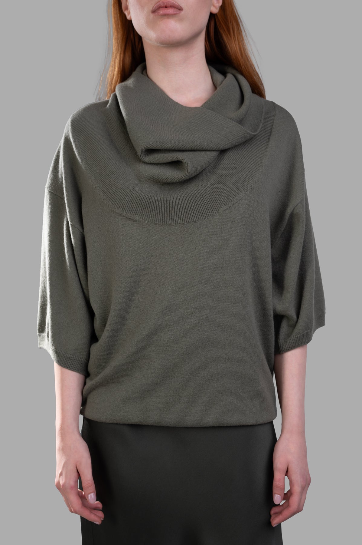 Gentry Portofino Olive Sweater with slouchy fit and shawl neckline, showcasing soft cashmere texture and 3/4 sleeves.