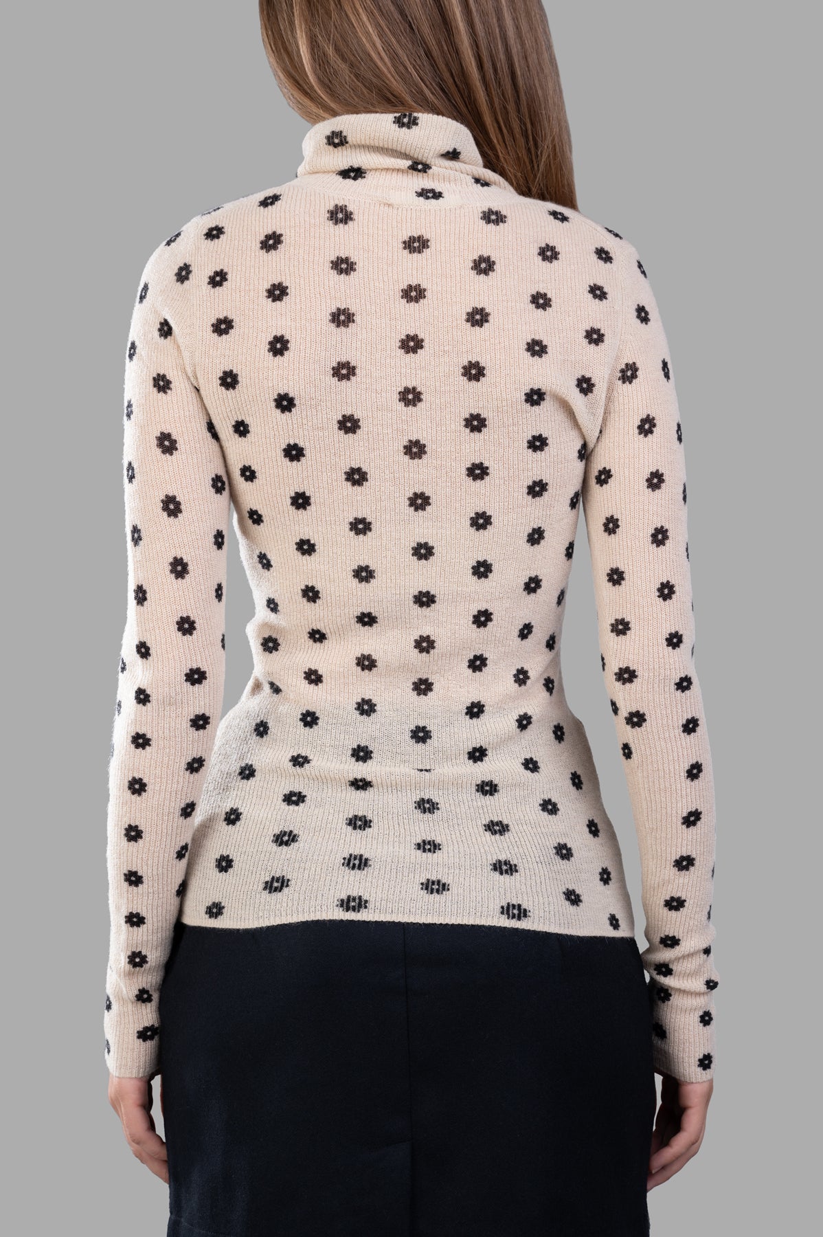 By Malene Birger Fioria Turtleneck Sweater in beige, featuring a floral motif and a slim fit, view from the back.