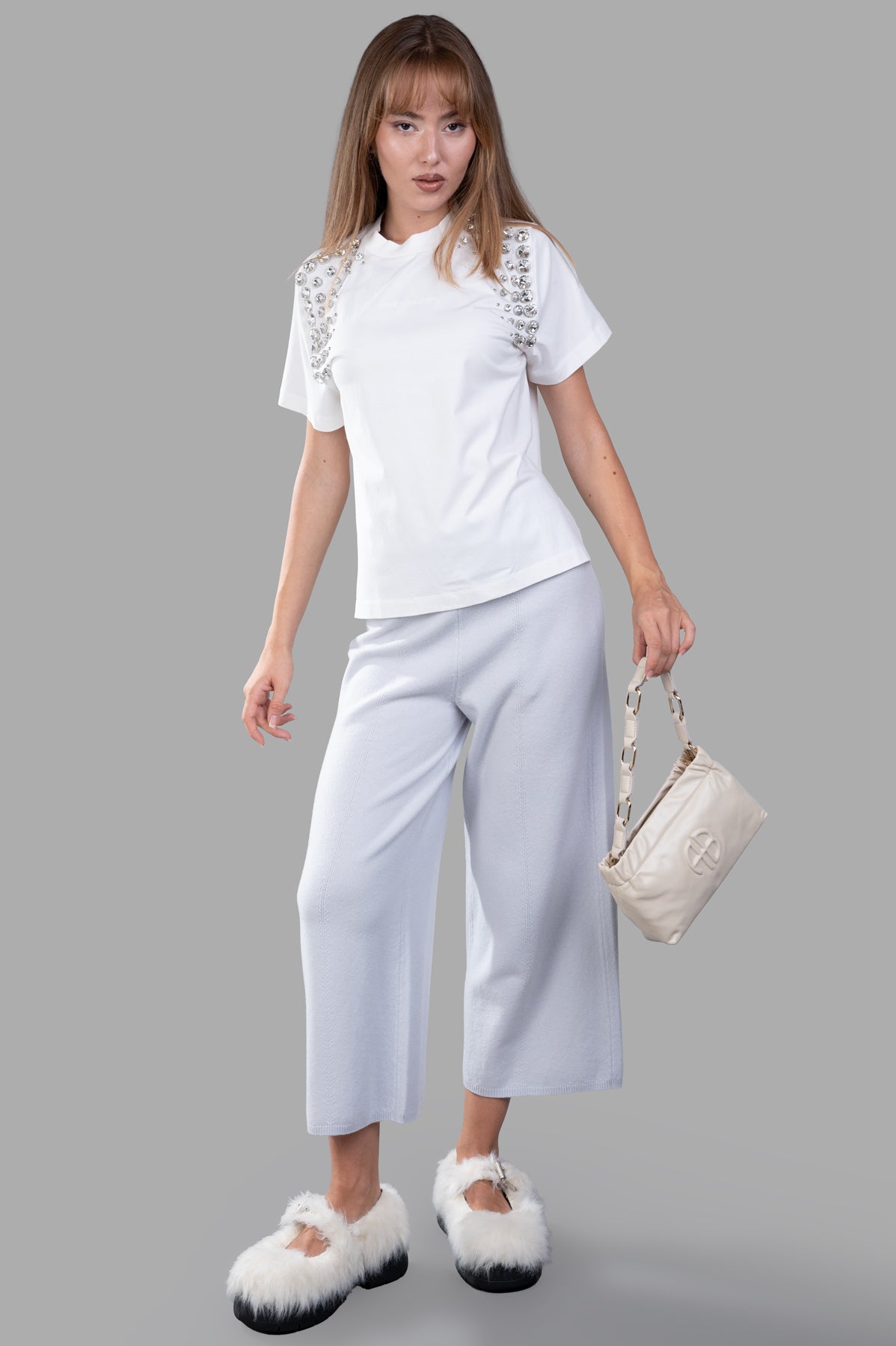 Joseph Soft Wool Culottes in light grey, modeled to show wide-leg fit and ribbed waistband, crafted from soft merino wool.