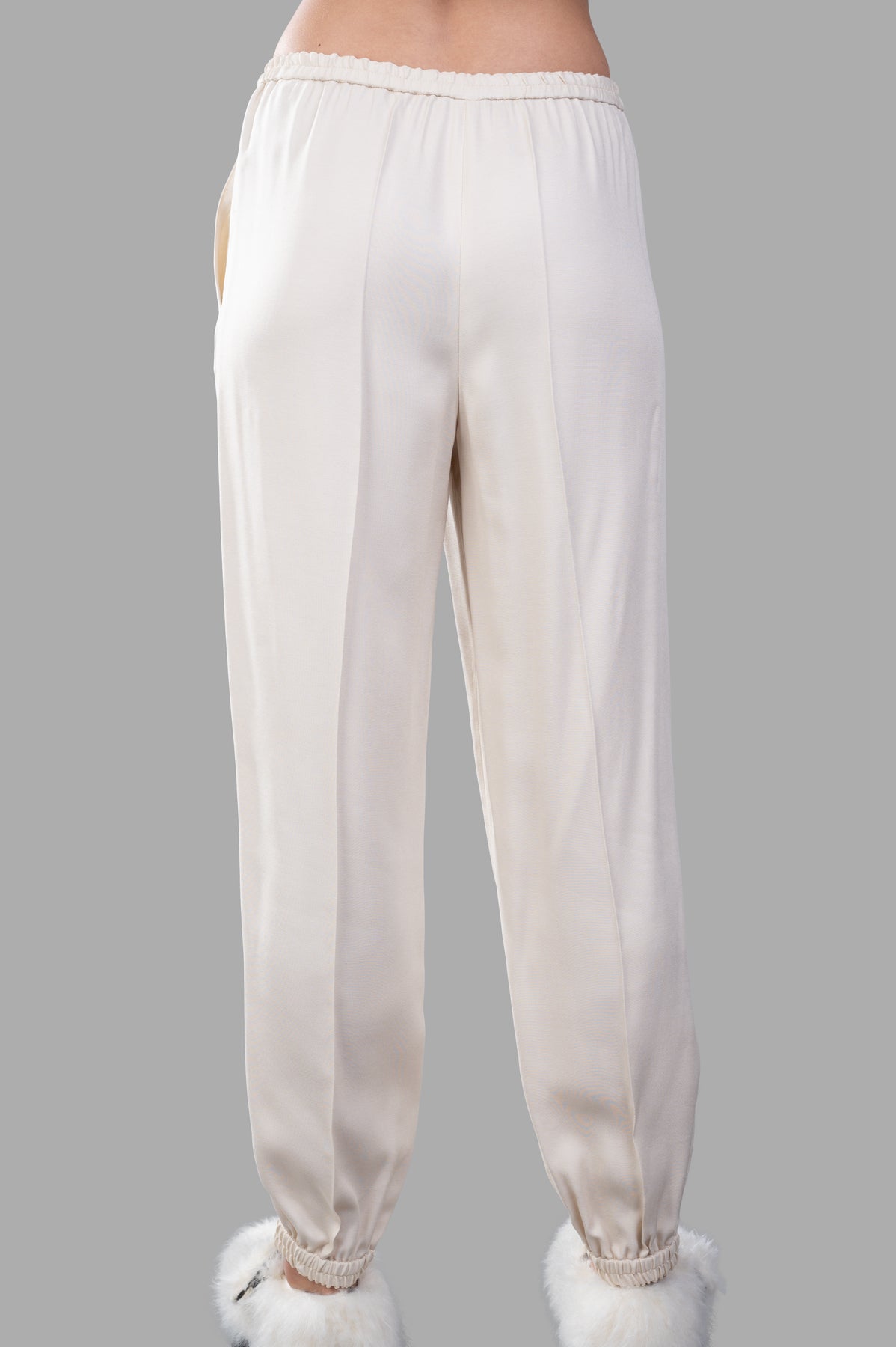 Joseph Viscose Twill Trousers in ecru, showcasing the back view with elasticated waistband and cuffs for a relaxed fit.