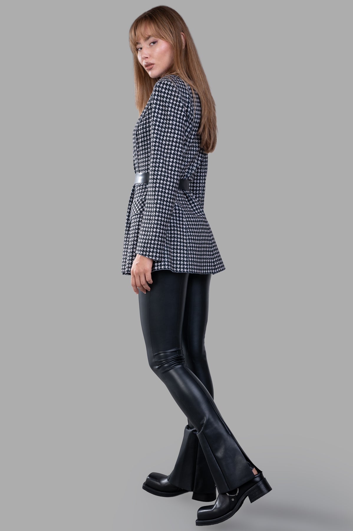 Norma Kamali Single Breasted Riding Jacket, flared fit, contrast collar, notched lapels, back view on model in black/white.