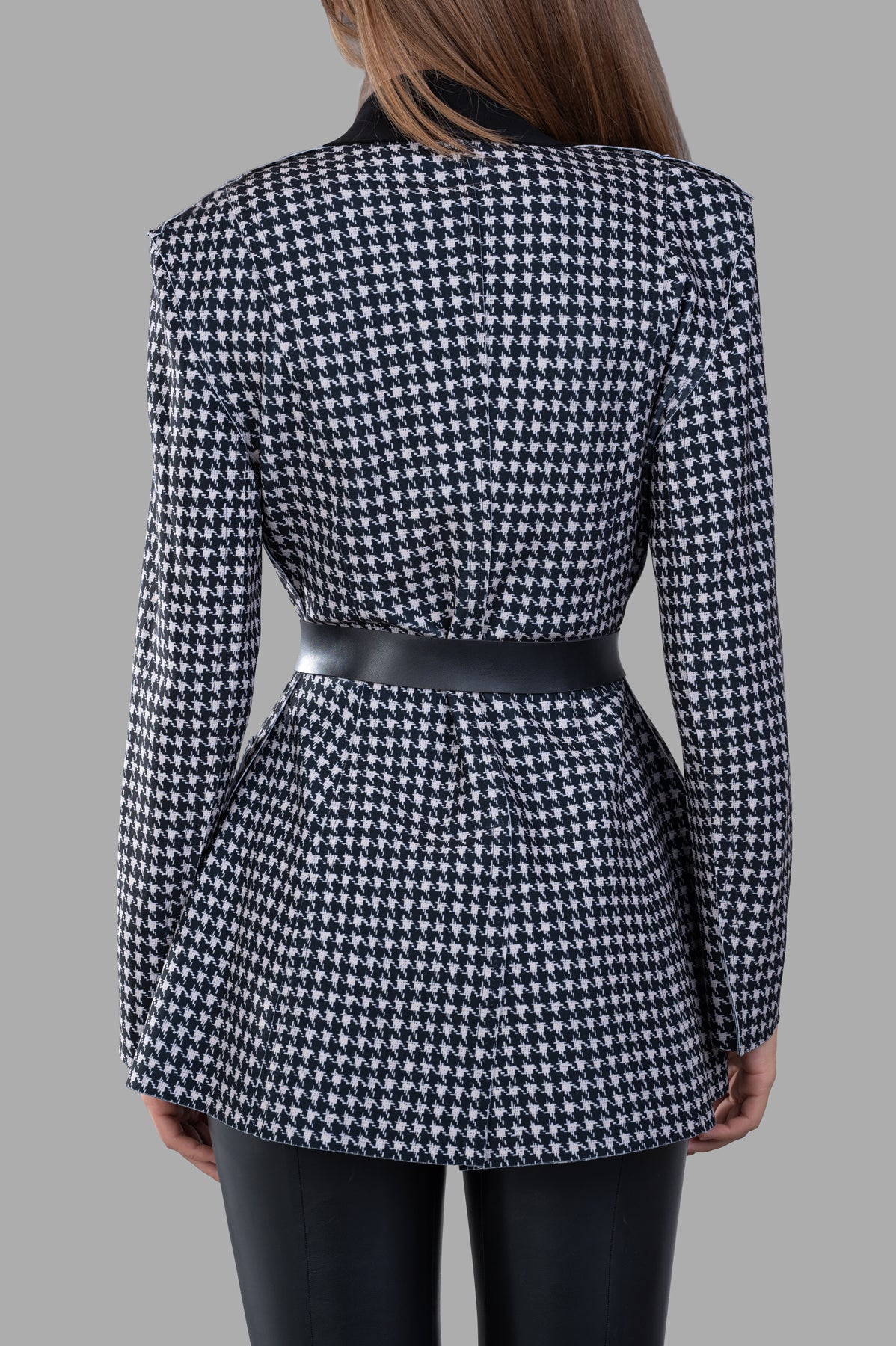 Norma Kamali Single Breasted Riding Jacket, back view showing flared fit, contrast collar, and included waist belt.