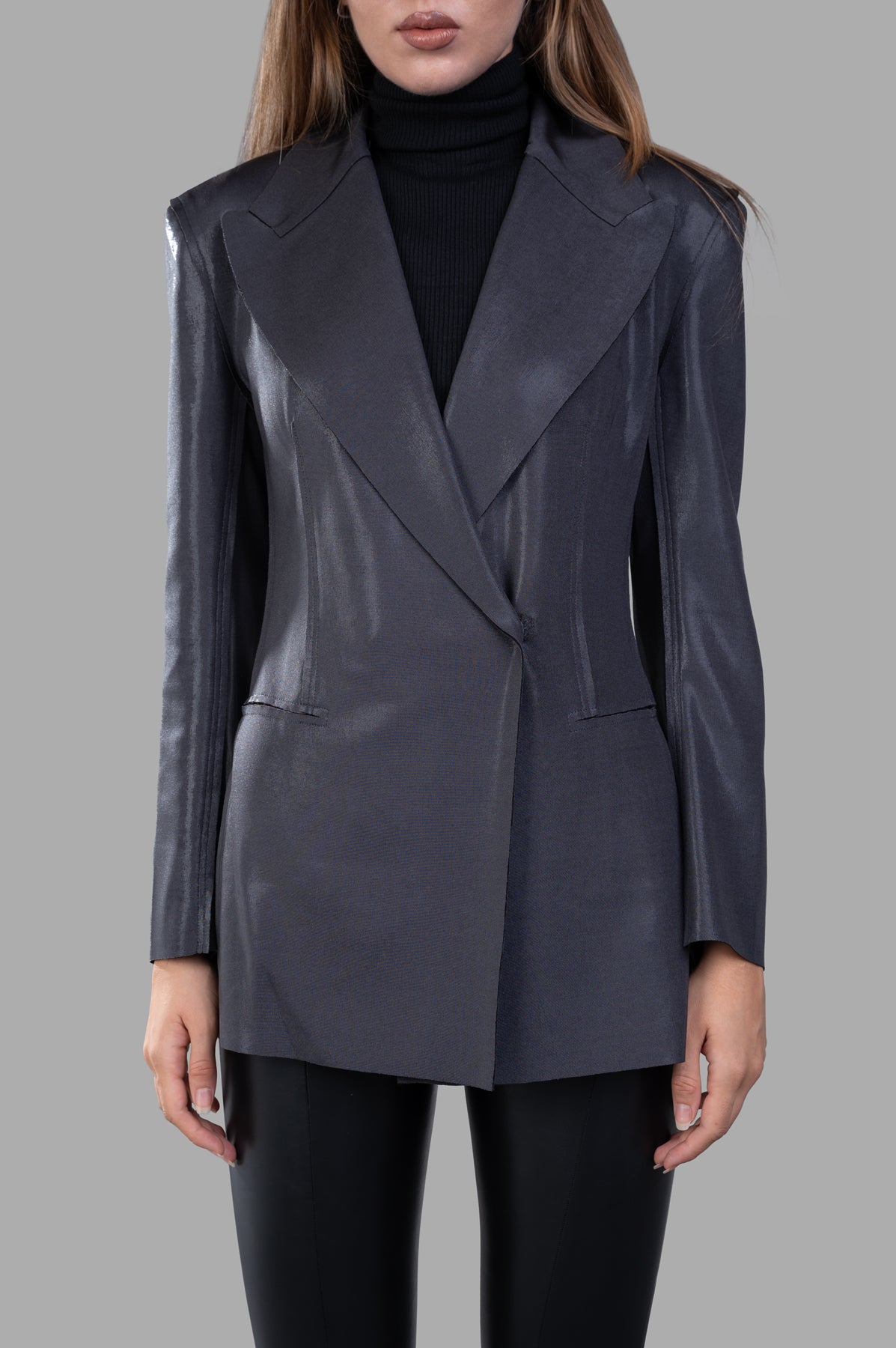 Norma Kamali Fitted Double-Breasted Jacket in silver, showcasing a slim fit, wide lapel, and velcro closure on model.