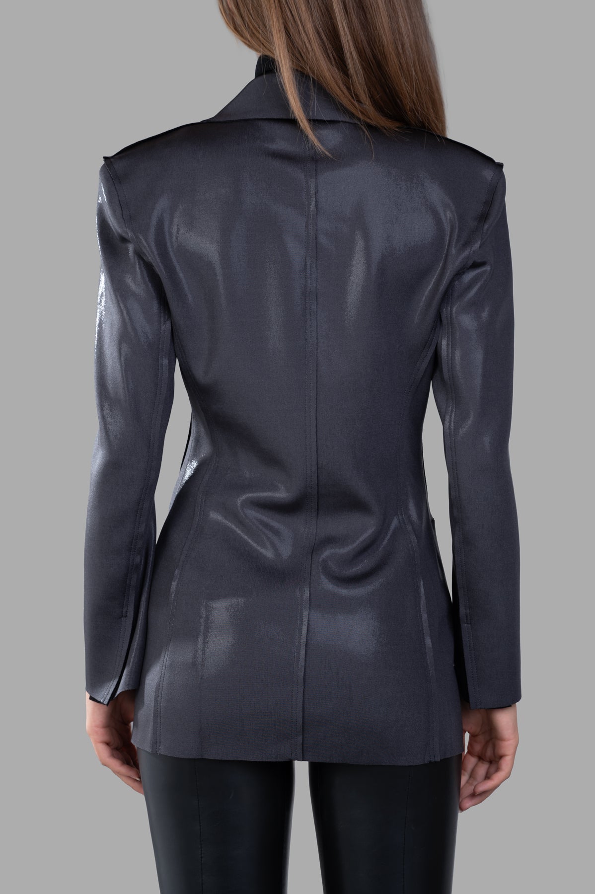Norma Kamali Fitted Double-Breasted Jacket, showcasing the back with a sleek silver finish and elegant shoulder pads.