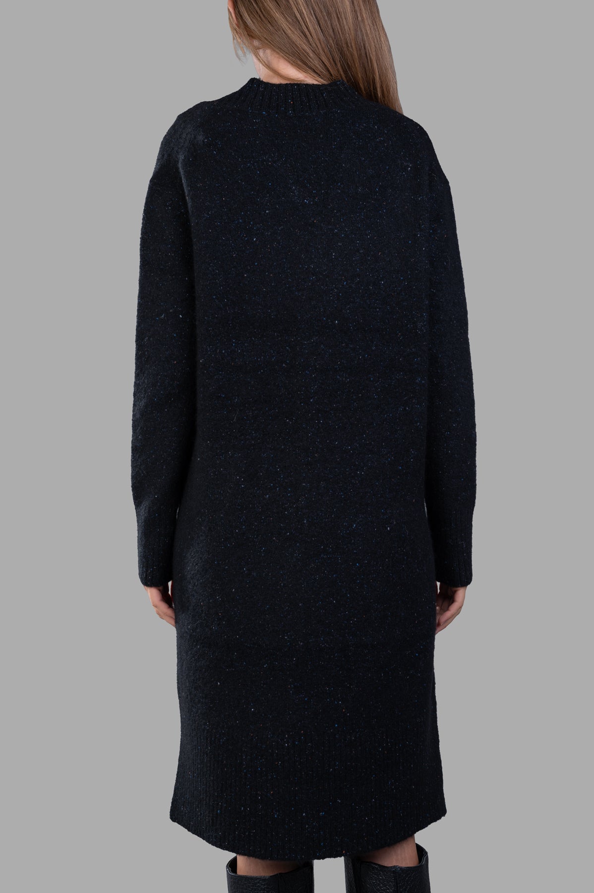 Joseph Alpaca Knit Dress shown on model from the back, featuring a cozy, textured black fabric and a relaxed fit.