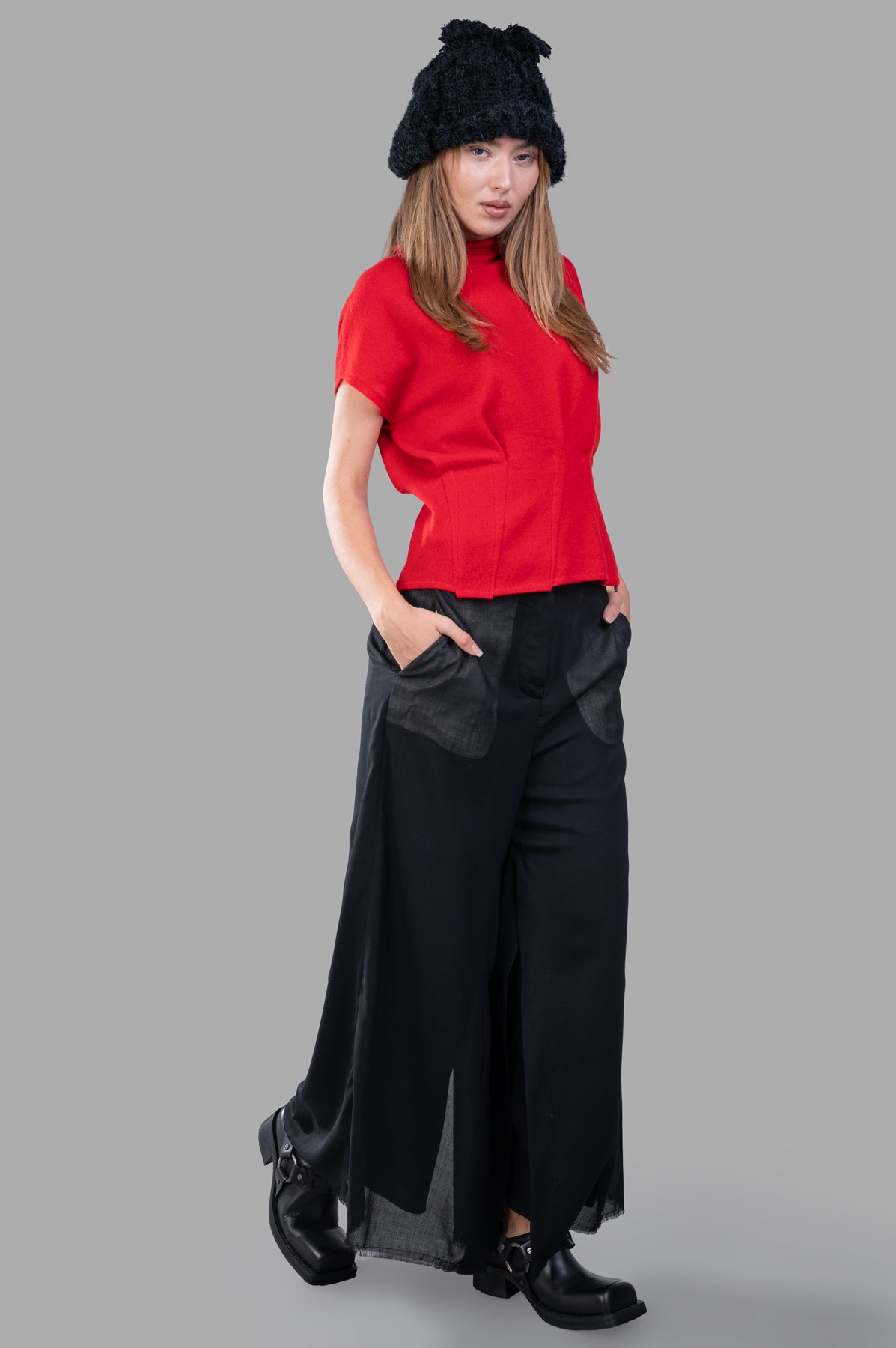Giovanni Cavagna Fitted Sweater Vest in red with cap sleeves, front view on model, tailored waist, sleek hem.