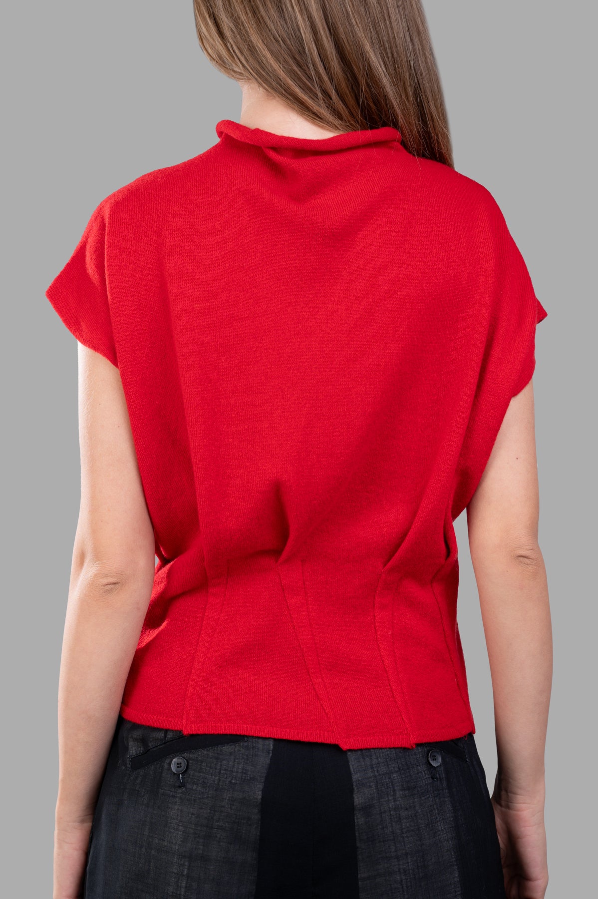 Giovanni Cavagna Fitted Sweater Vest in red, showcasing cap sleeves and tailored waist from a back view.