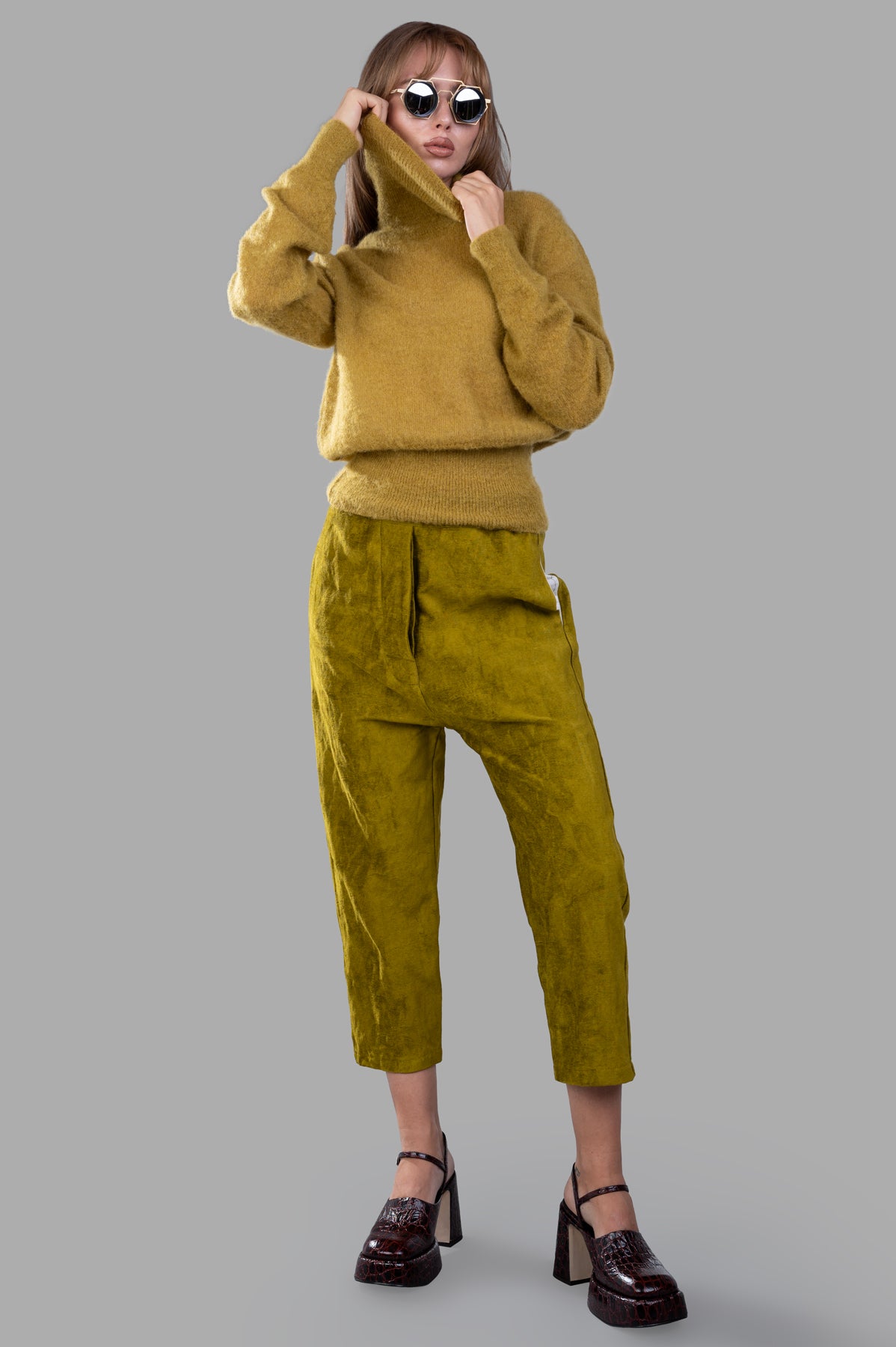 Marc Point turtleneck sweater in ochre, model wearing with ribbed cuffs and hem, showcasing soft mohair blend.