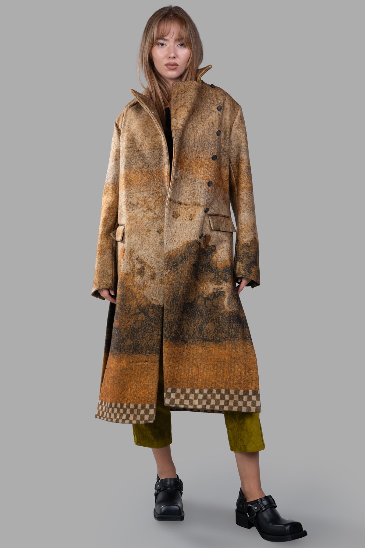 Masnada Printed Coat front view featuring asymmetric design, art print in multicolor, with flap pockets. Model wearing coat.