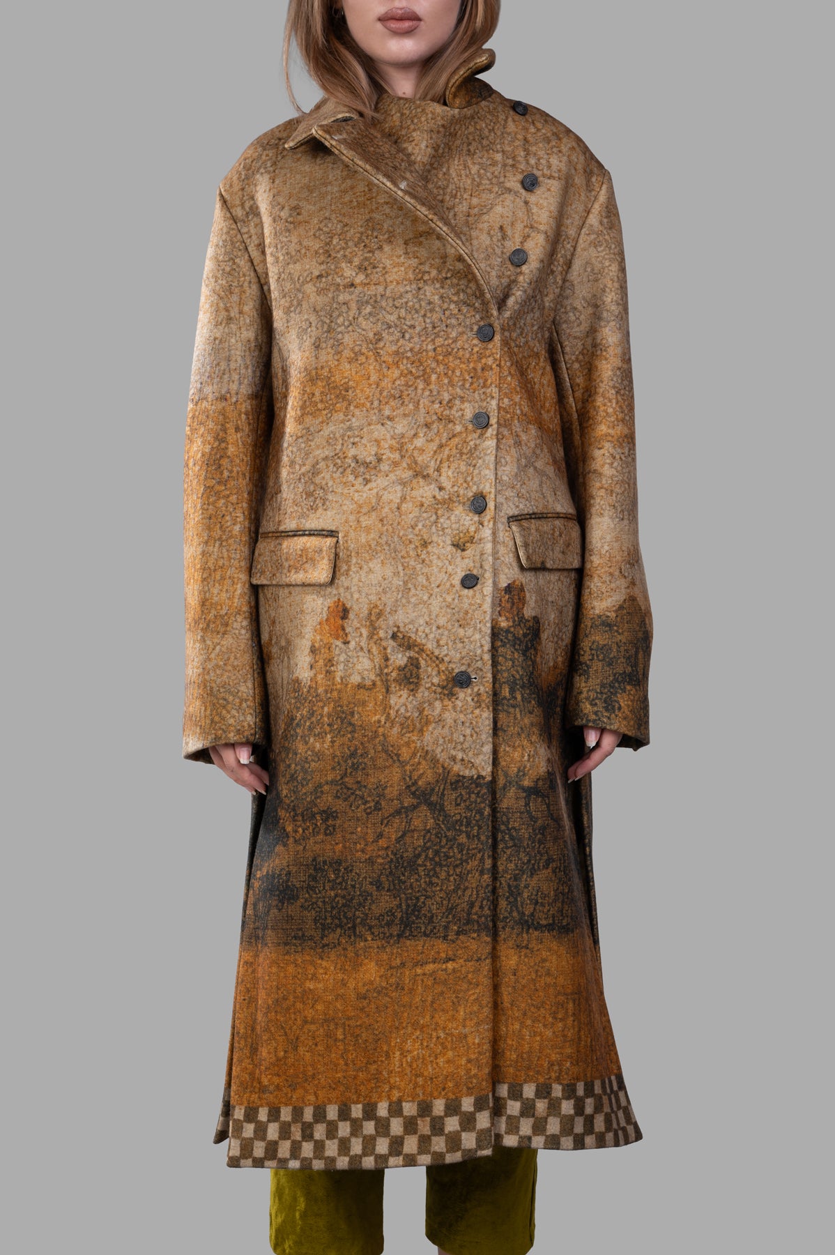 Masnada Printed Coat showcasing a unique art print design with asymmetric fastening and flap pockets, displayed on model.