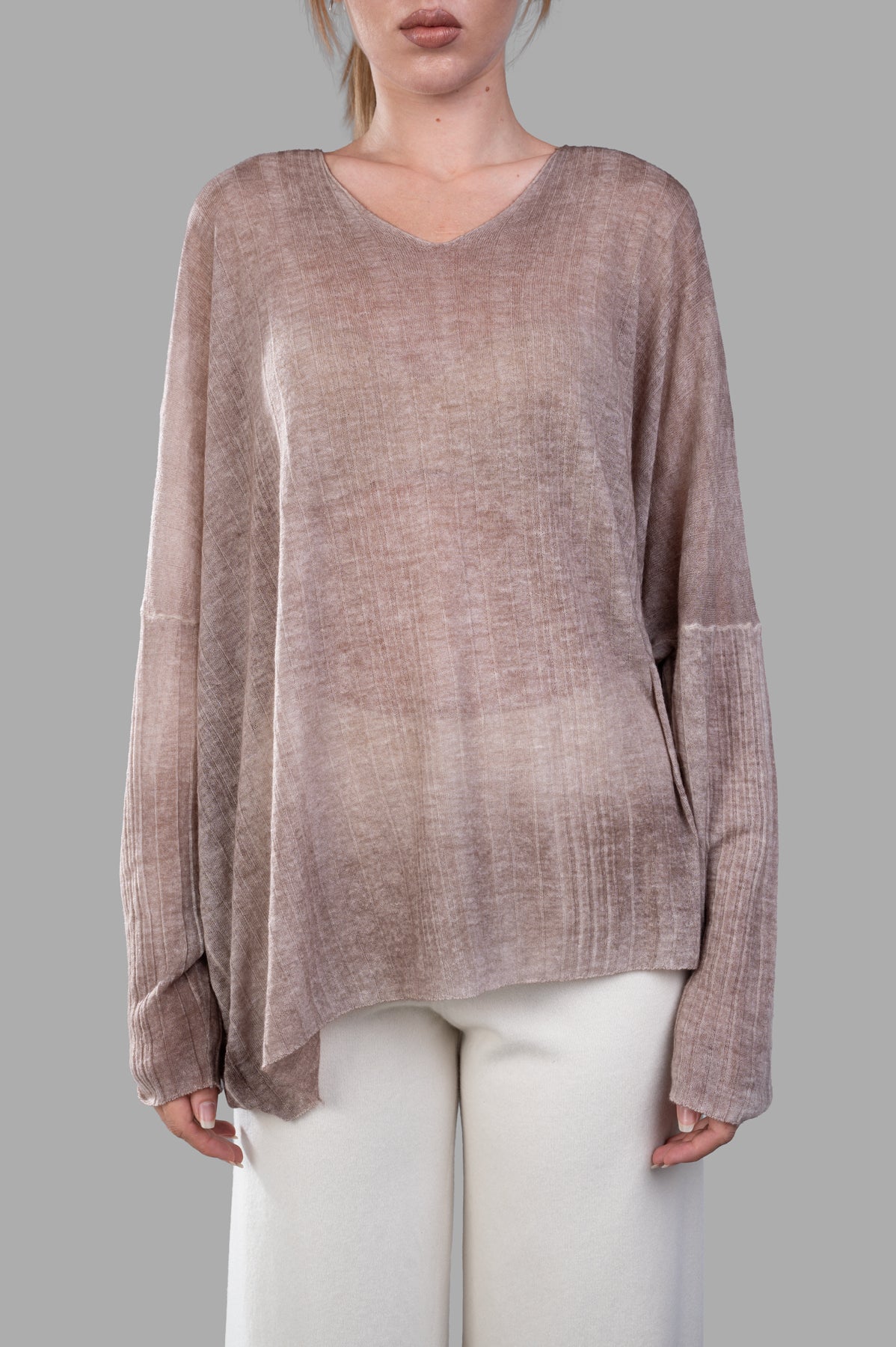 Avant Toi Ribbed Oversized Sweater in beige, displayed on model, featuring soft cashmere fabric, V-neck, and unique.