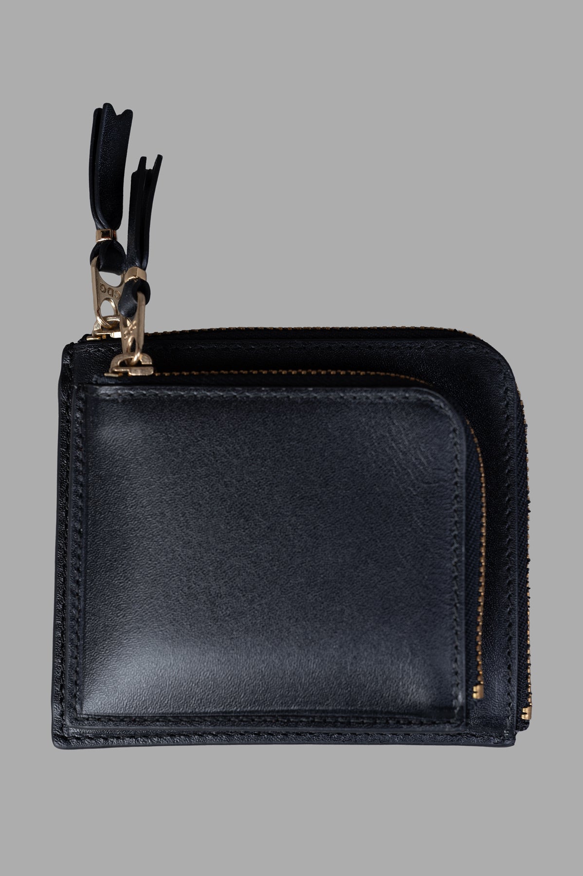 Comme des Garçons Small Double Wallet in black cowhide, showcasing front view with dual zippers for secure closure.