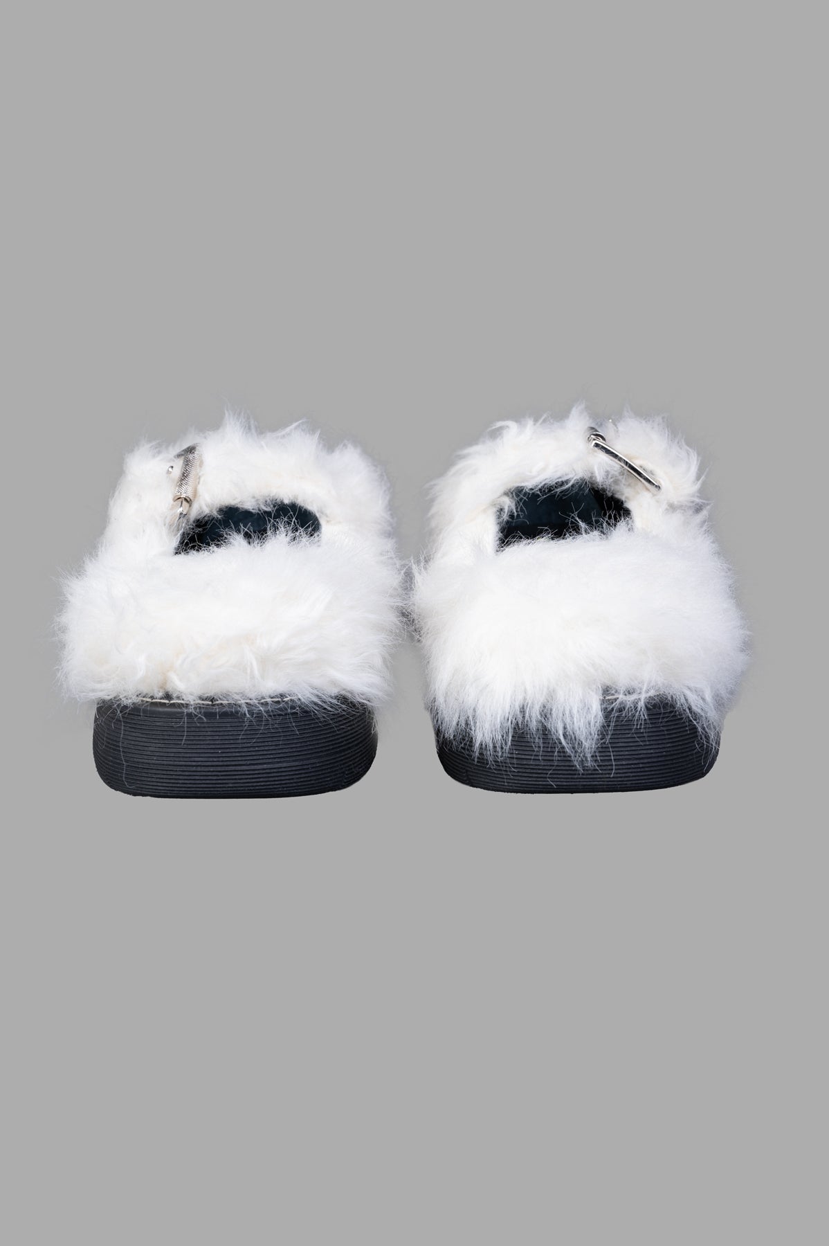 MSGM Faux-fur Buckled Shoes in elegant ivory white, featuring pointed toe and buckle, showing front detail and texture.