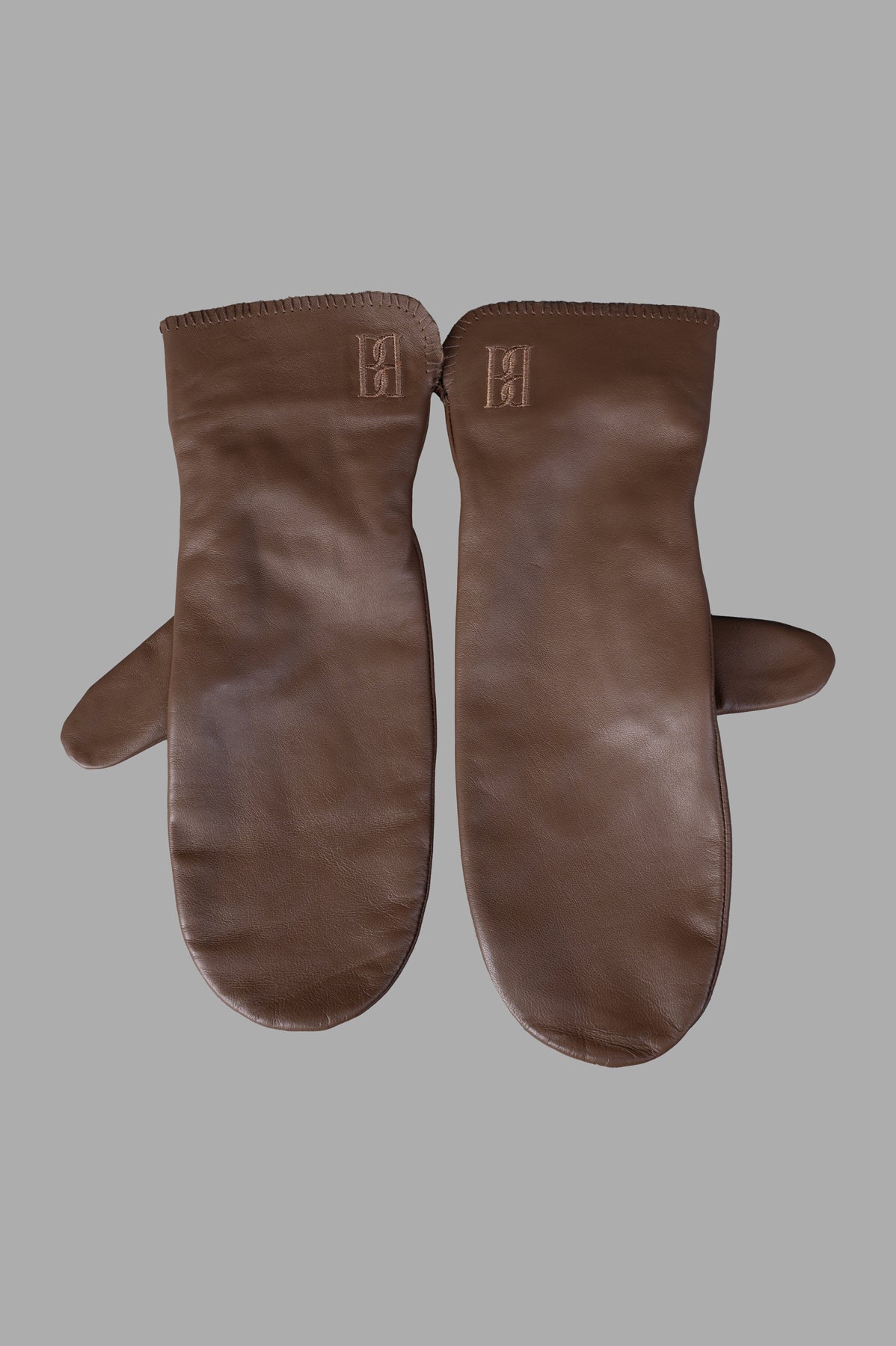 By Malene Birger Ginnyl Leather Mittens, front view showcasing buttery soft Shitake leather with elastic band detail.
