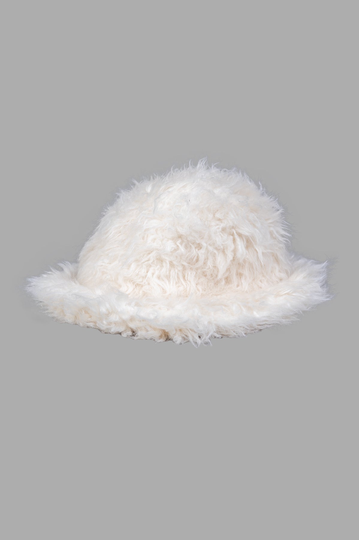MSGM Faux Fur Hat in ivory white, side view showcasing fluffy texture, perfect for cozy winter fashion.