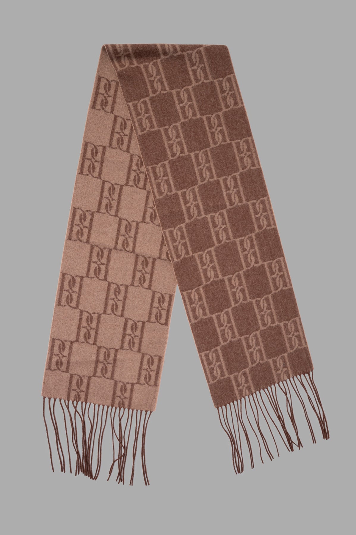 By Malene Birger. Manno Wool Scarf featuring a monogram print and fringed edges, displayed in a warm brown tonal design.