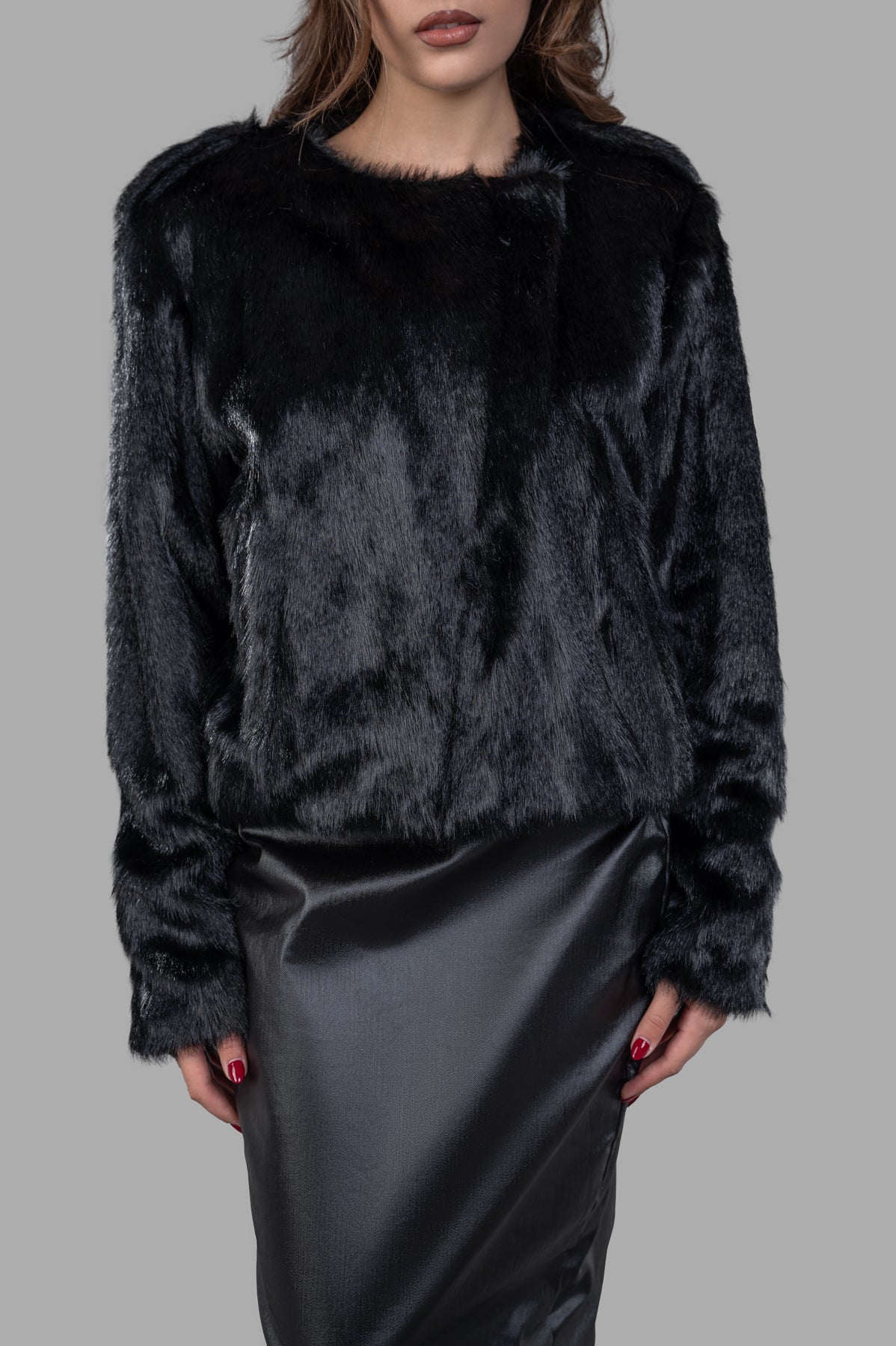 Alabama Muse Faux-fur Jacket in black, showcasing soft texture, long fur, and a stylish cropped design on model.