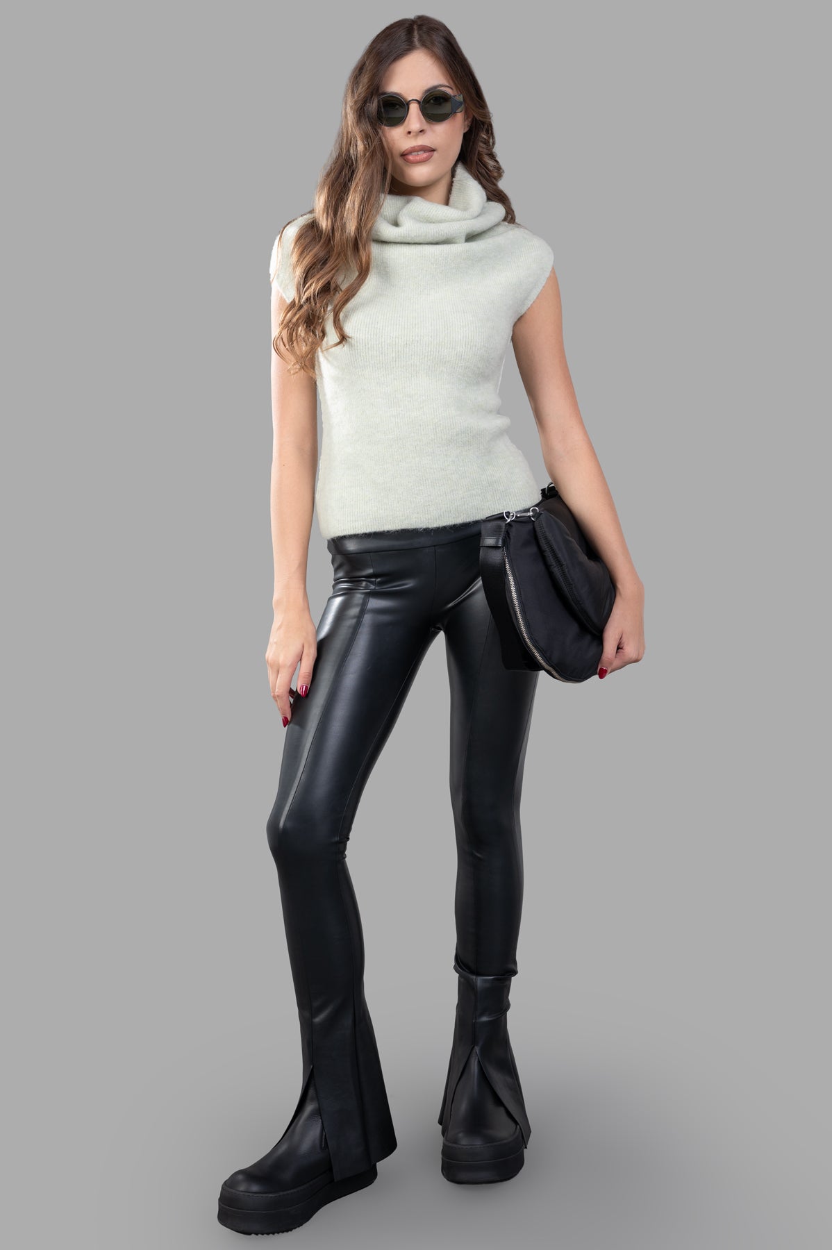 Rick Owens Crater Sweater Vest in mint green, shown on-model with a high ribbed cowl neck and sleeveless design.