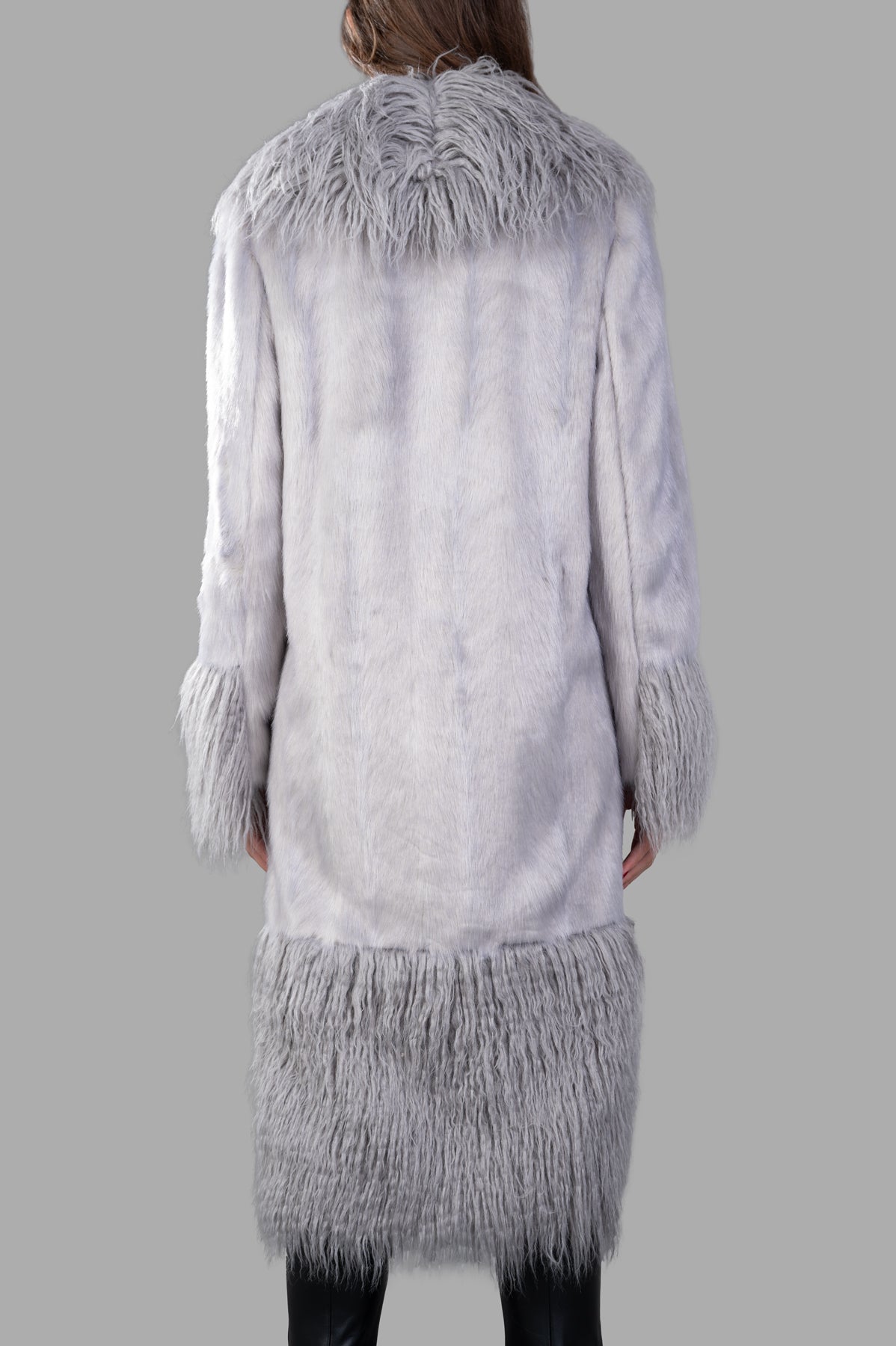 Alabama Muse Long-line Faux-fur Coat in grey, featuring a soft, textured back with fringed detailing and long sleeves.