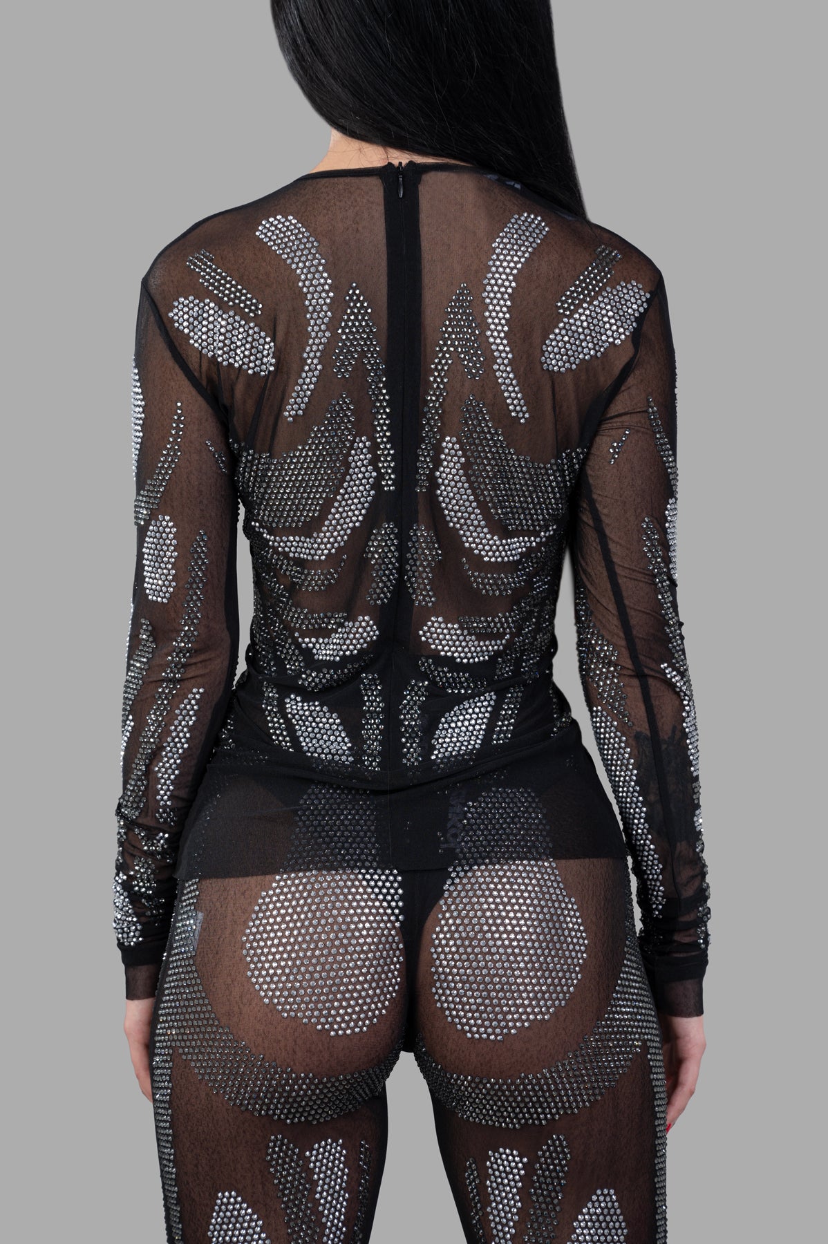 Natasha Zinko Rhinestones Embellished Top showcasing a transparent design with eye-catching rhinestone detailing on the back.