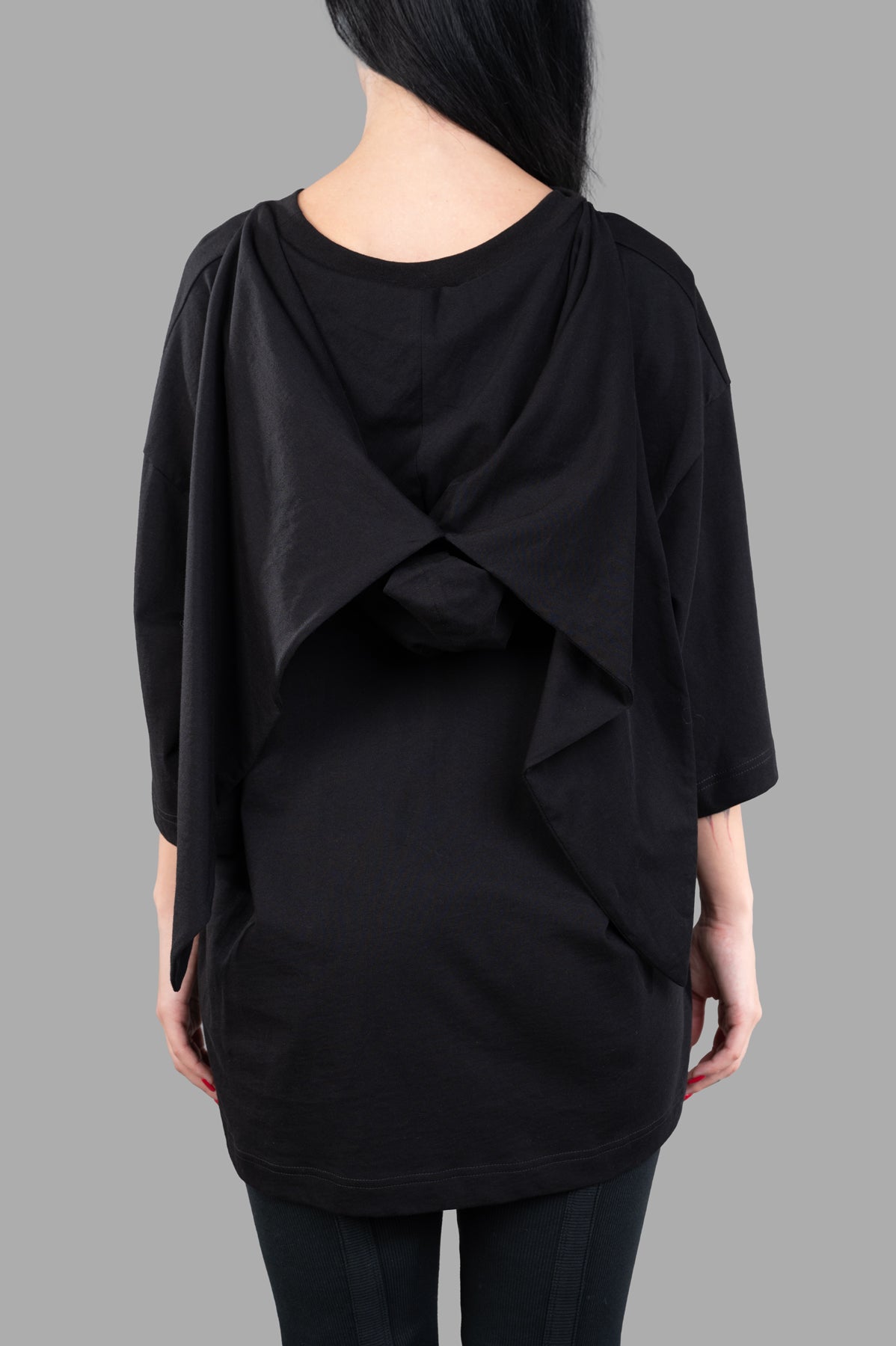 **Alt text:** Natasha Zinko Bandit T-shirt featuring a stylish back design, shown on model with loose fit.