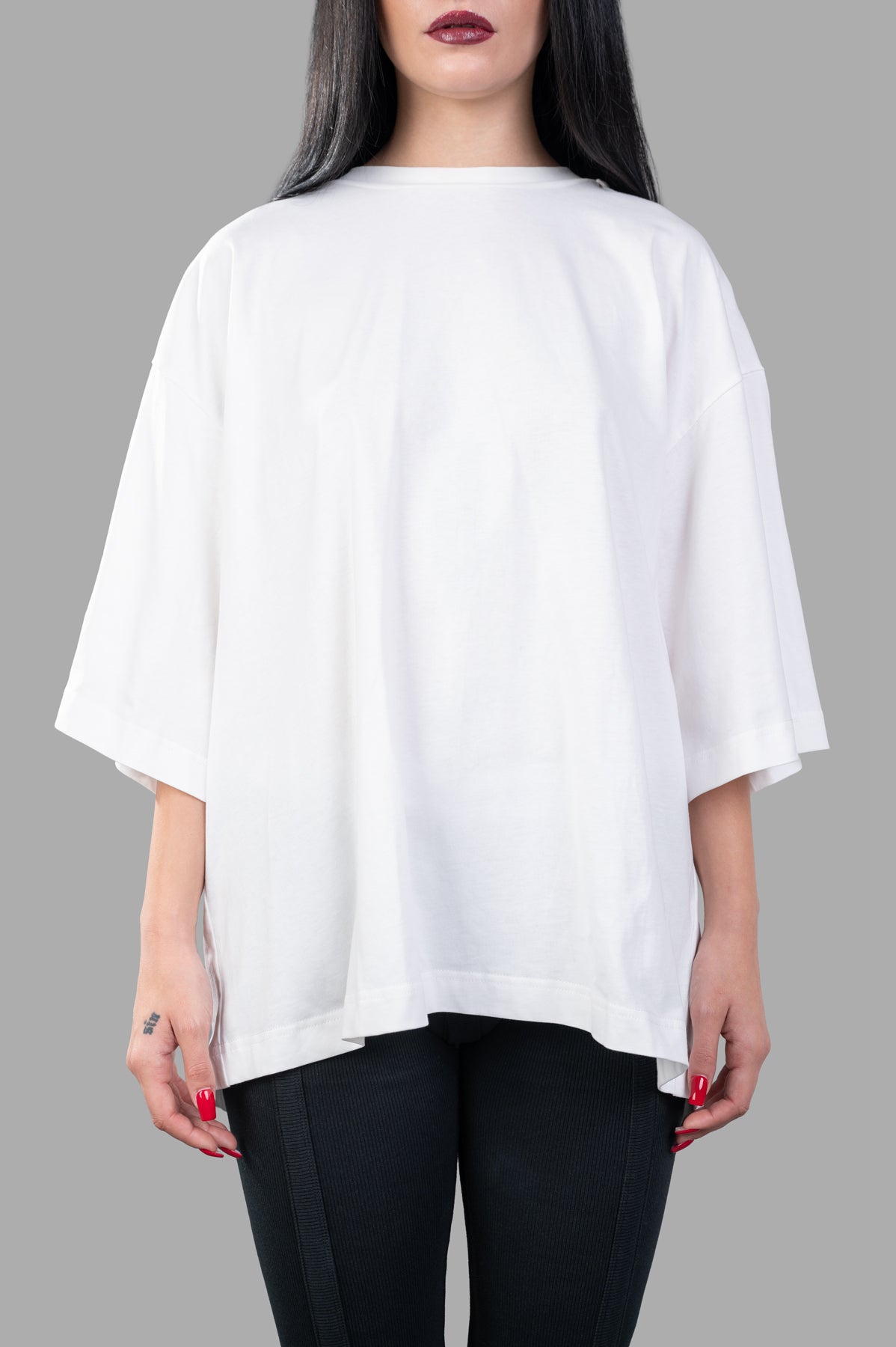 Natasha Zinko White Bandit T-shirt, oversized design with built-in hood, showcased in white, on model with black pants.