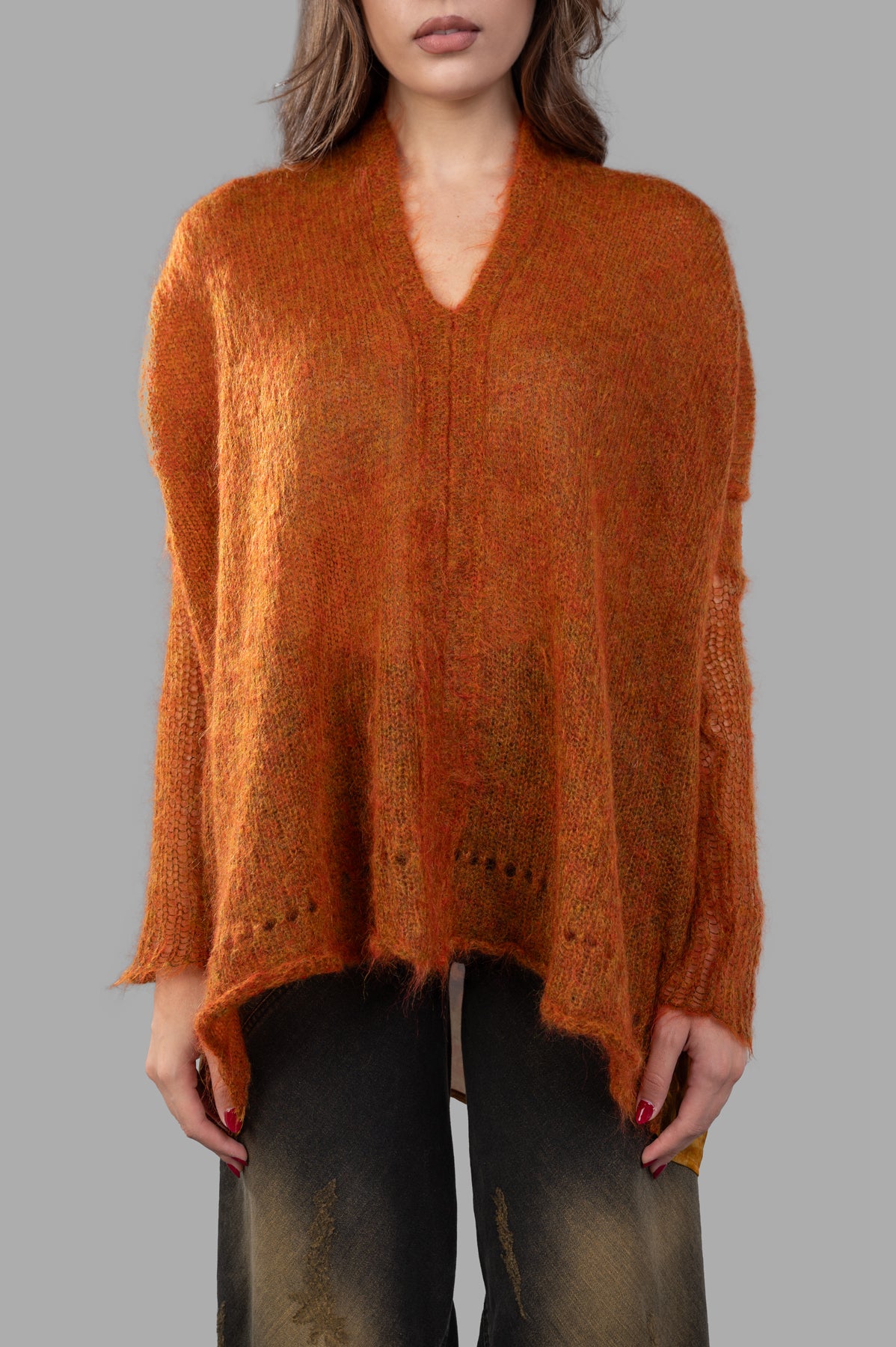Masnada Mohair Sweater in burnt orange, showcasing the front design and elongated back for a modern look and soft texture.