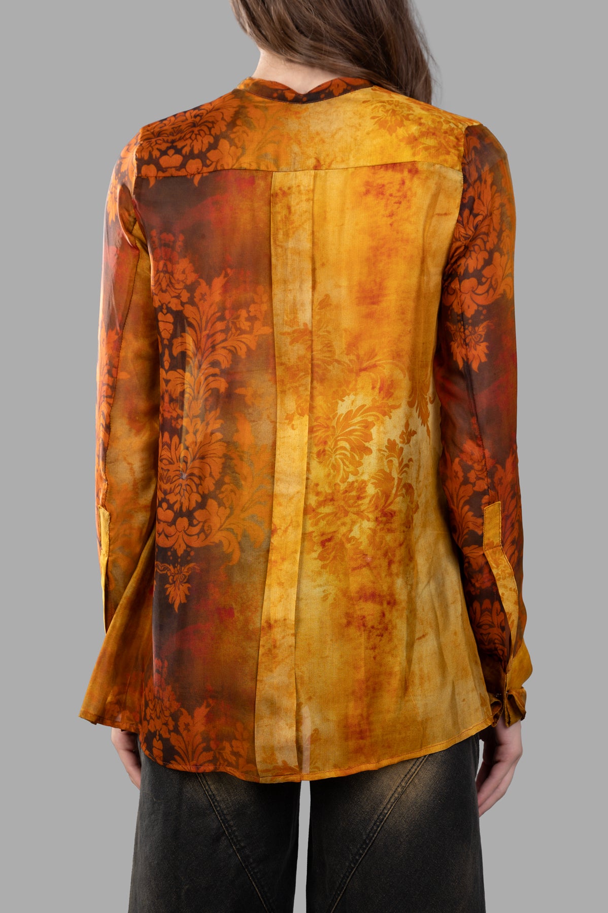Masnada Silk Printed Shirt in vibrant burnt orange, showcasing the back design and elegant graphic print details.
