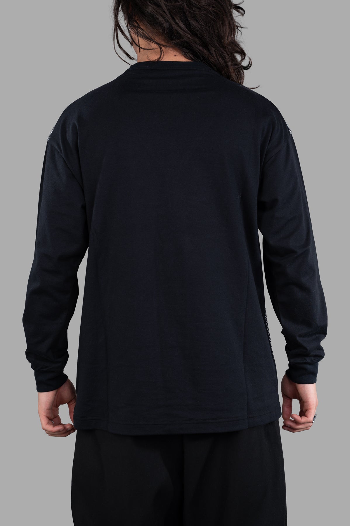 Comme des Garçons Relaxed-fit Sweater, black cotton top shown from the back, featuring long sleeves and a relaxed silhouette.