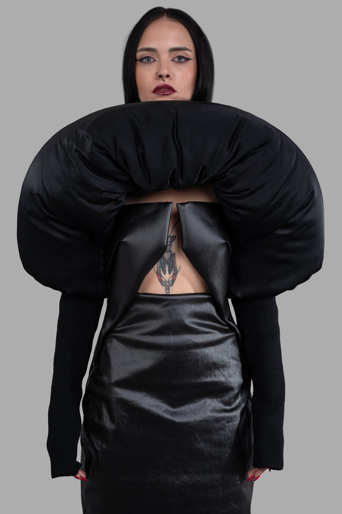 Rick Owens Porterville Runway Duvetina features a front view of the unique black duvet yoke, showcasing its boat neckline.
