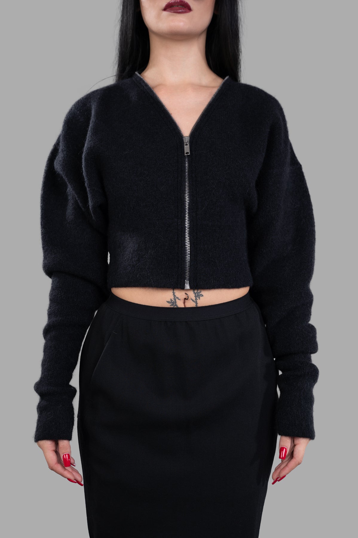 Rick Owens Cropped Cardigan in black with zip front, showcasing wide shoulders and batwing sleeves on model.