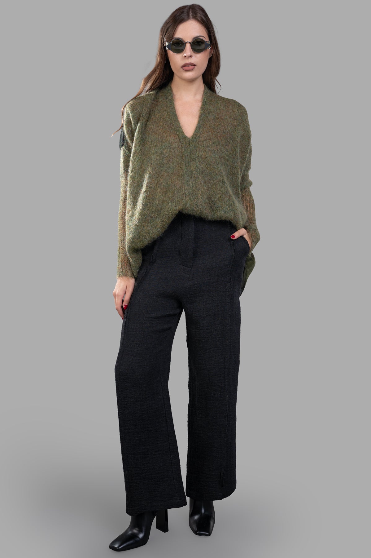 Marc Point Front-pleat Pants in black, on-model, showcasing high-waist design with side pockets and flattering fit.