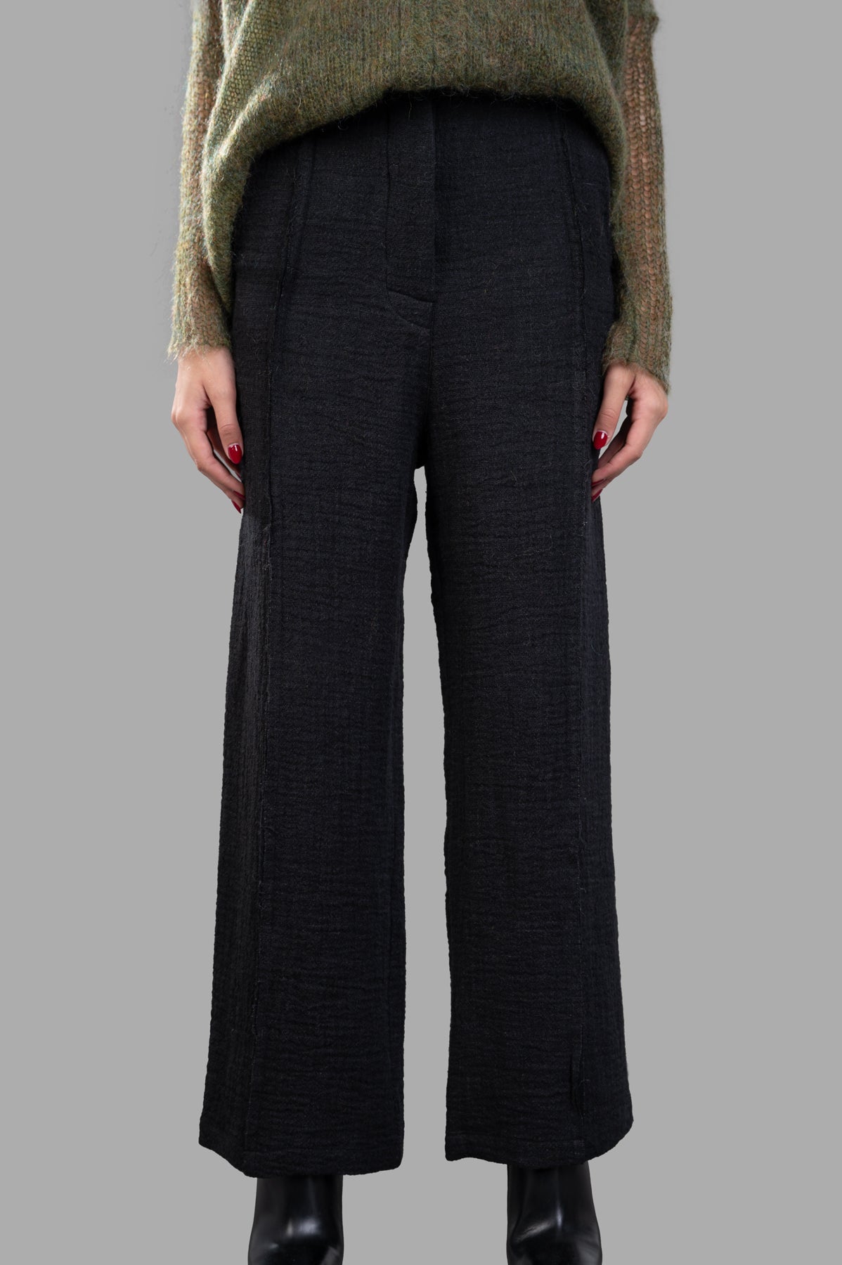 Marc Point Front-pleat Pants in black, featuring high waist and front pleats, showcased on model from the front.