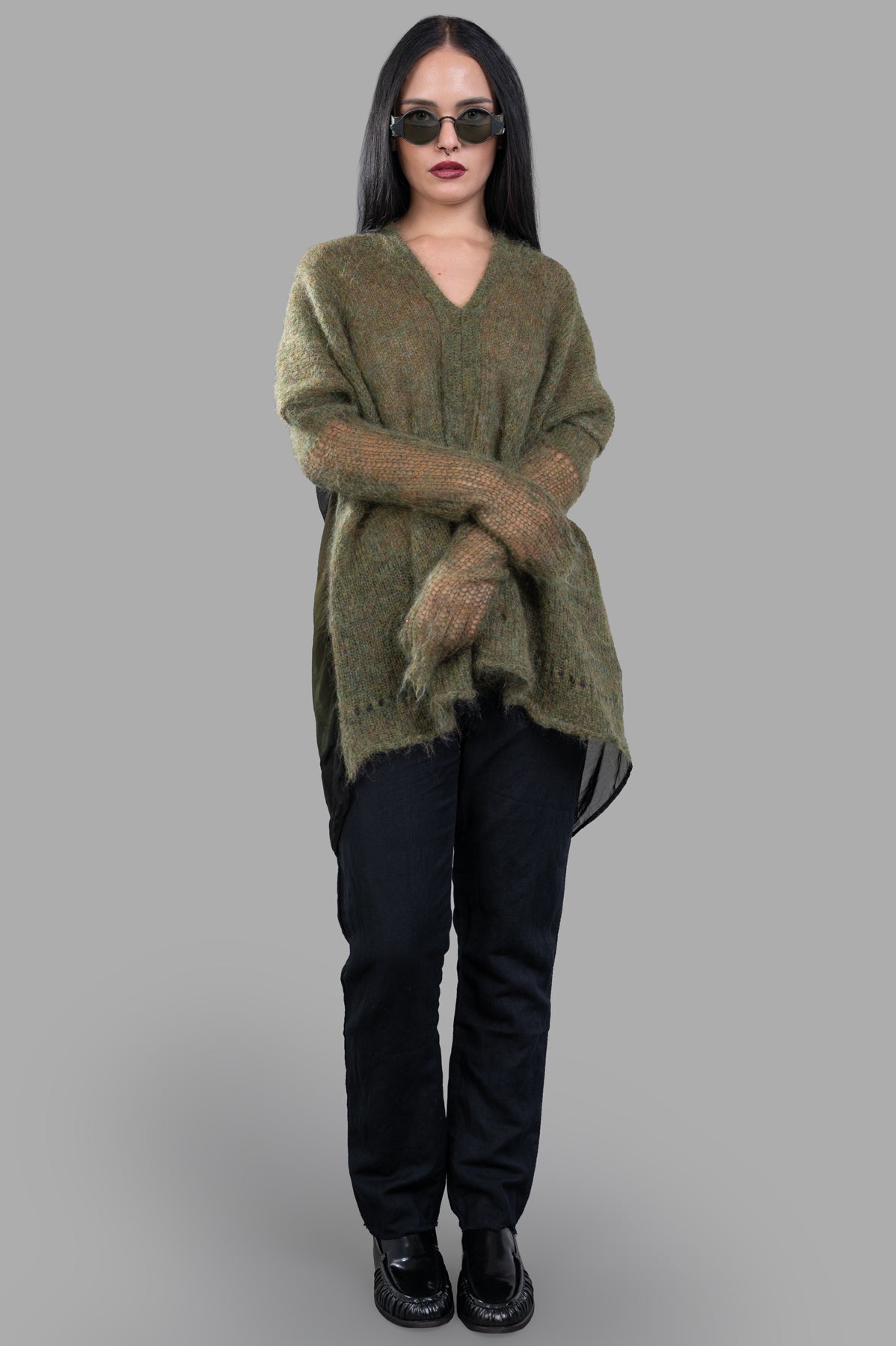 Masnada Moss Mohair Sweater in green, on-model front view, showcasing V-neck and elongated back design.