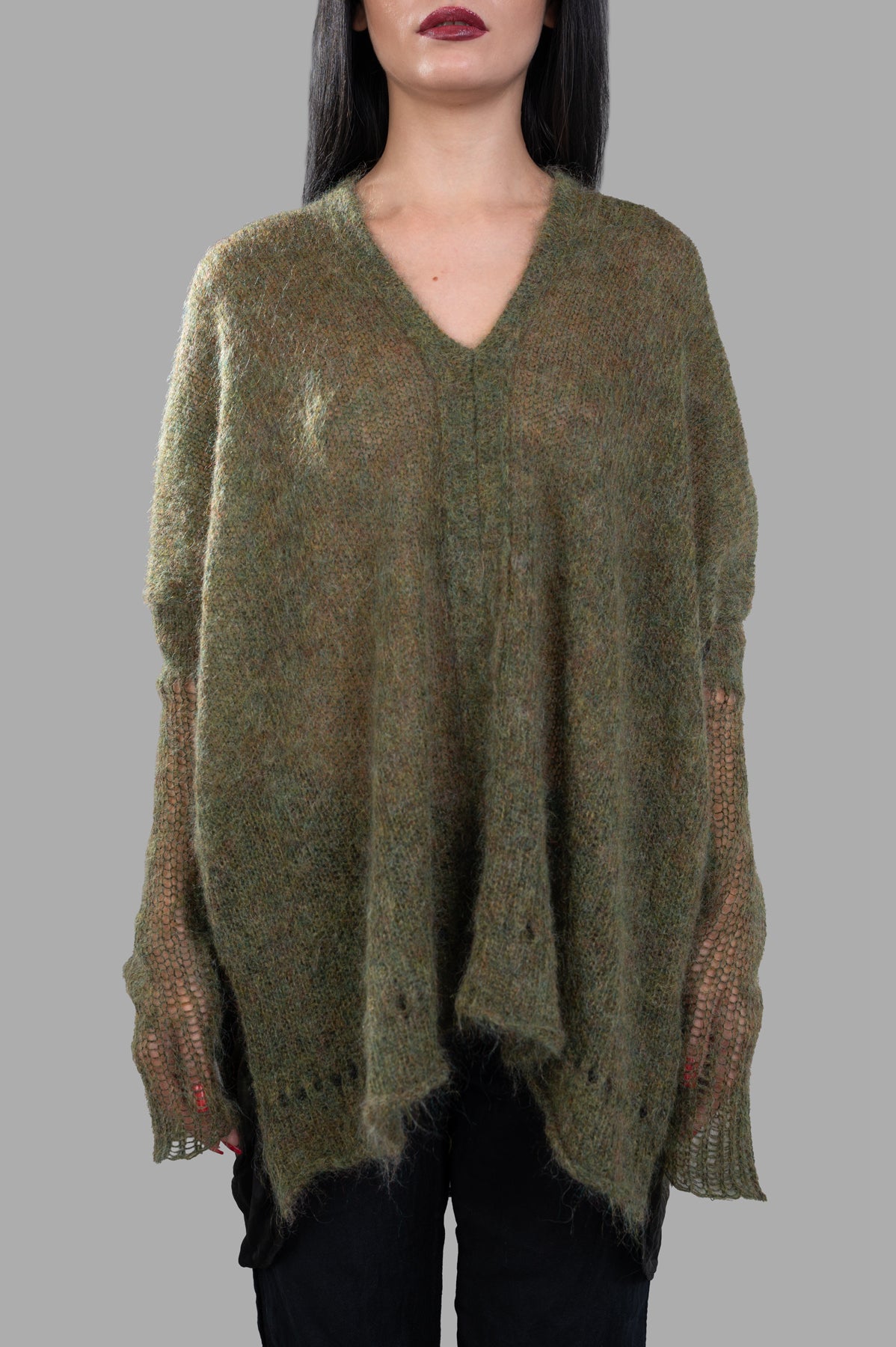 Masnada Moss Mohair Sweater with a deep V-neck, showcasing a soft green fabric and unique open-knit sleeve detailing.