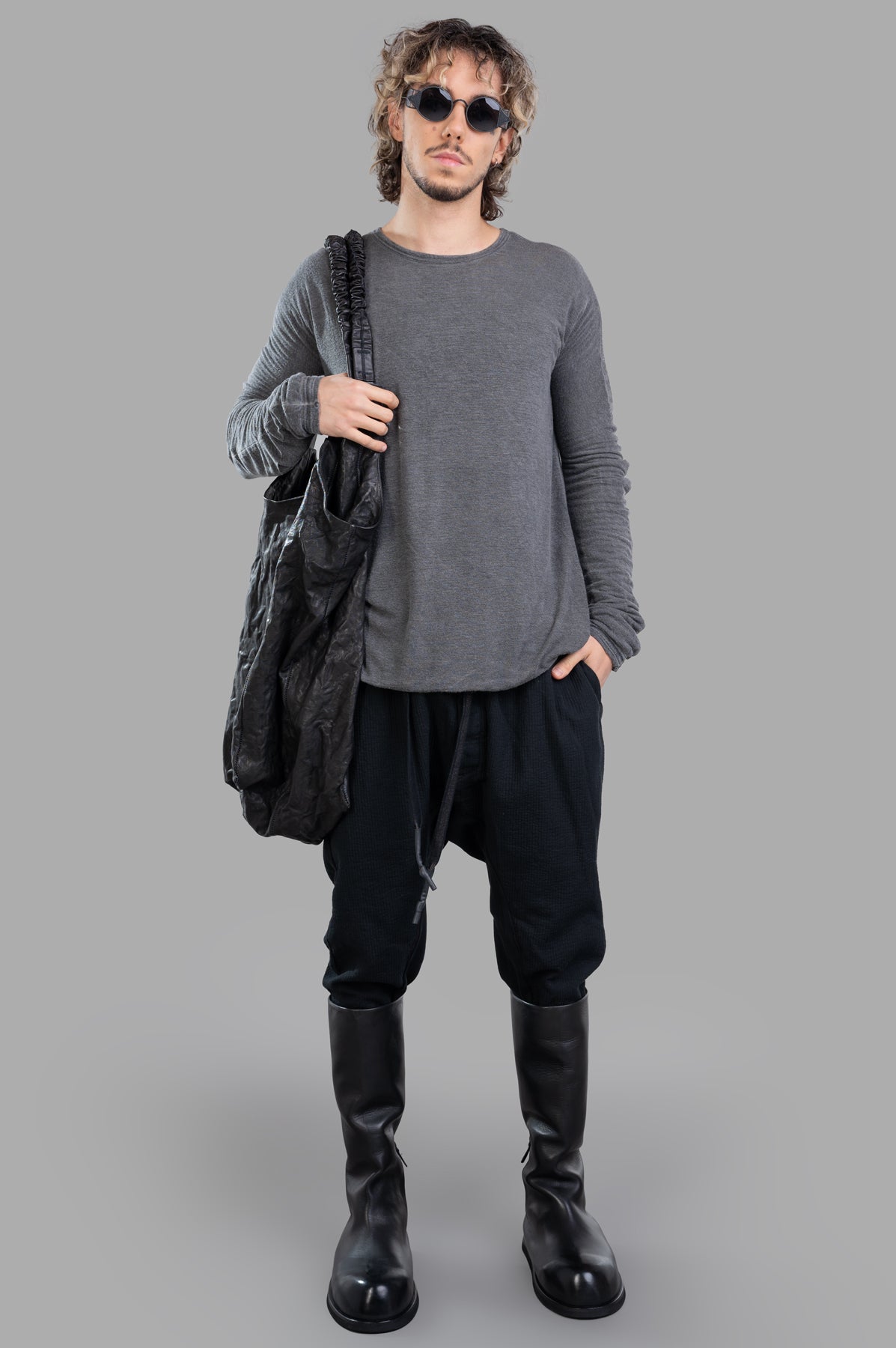 Isaac Sellam grey long-sleeved T-shirt on model, showcasing crewneck and luxury jersey fabric, front view.