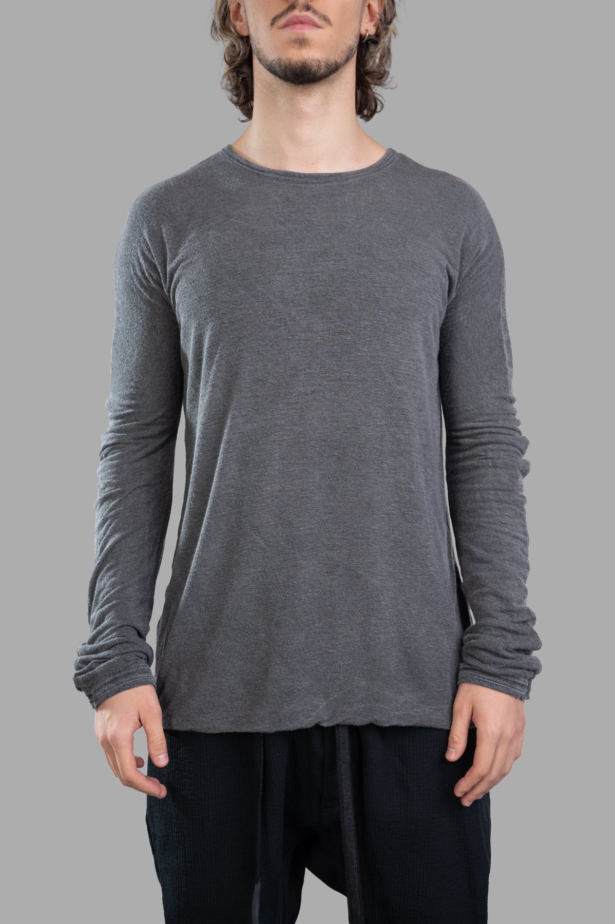 Isaac Sellam long-sleeved T-shirt in grey, featuring a crewneck and detailed texture, worn by a model.
