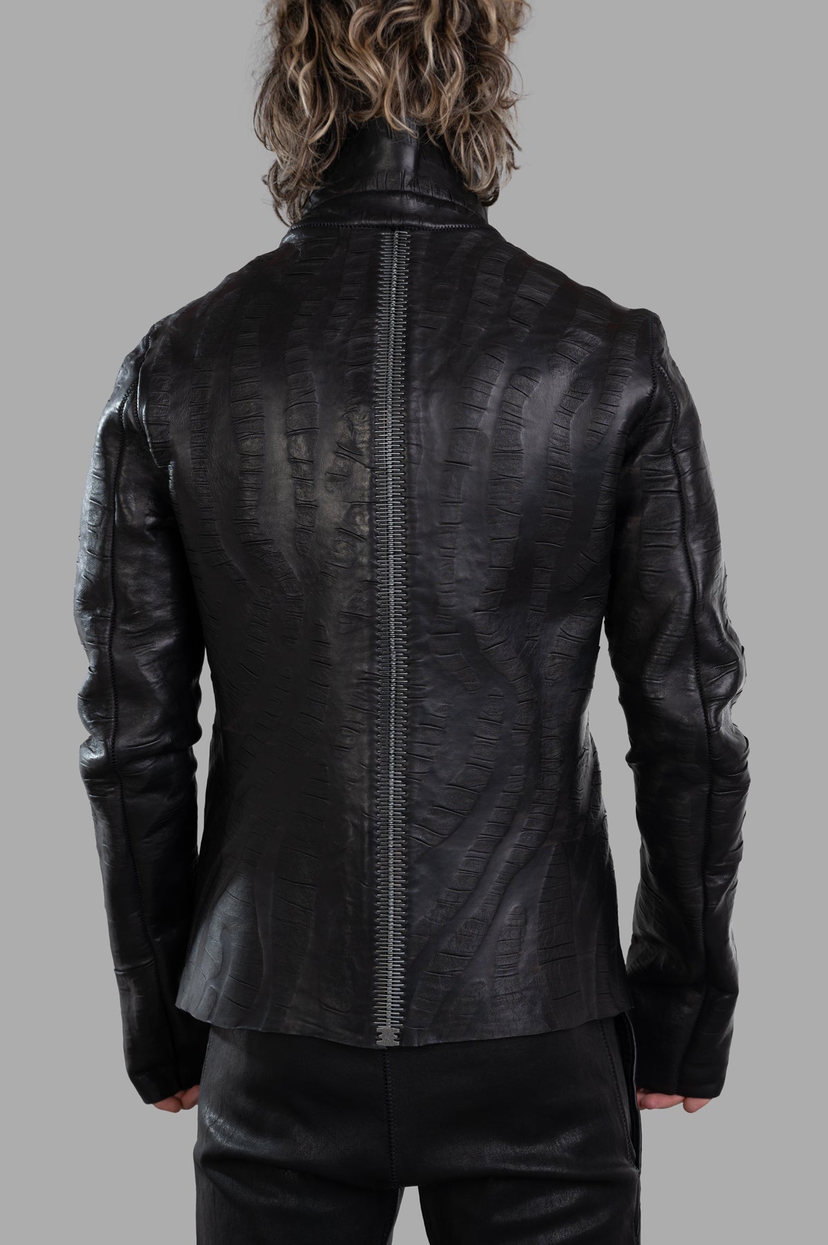 Isaac Sellam Creased Biker Jacket, back view showcasing unique lambskin texture and decorative zip details.
