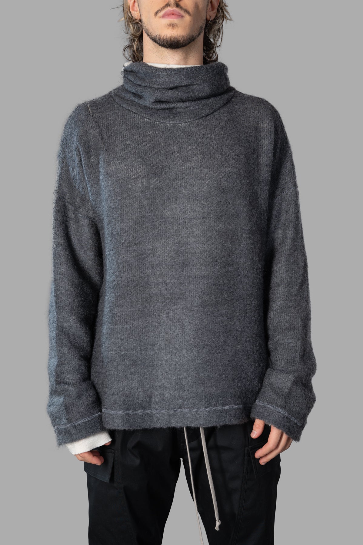 Marc Point Roll-neck Sweater in grey features a relaxed fit, dropped shoulders, and soft textured fabric displayed on model.