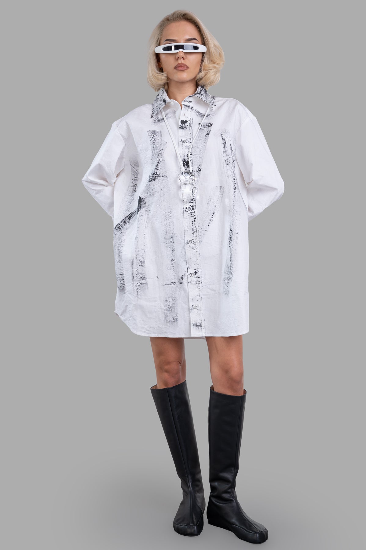 Giovanni Cavagna Printed Shirt Dress on model, front view, oversized white cotton with black stain prints, edgy style.