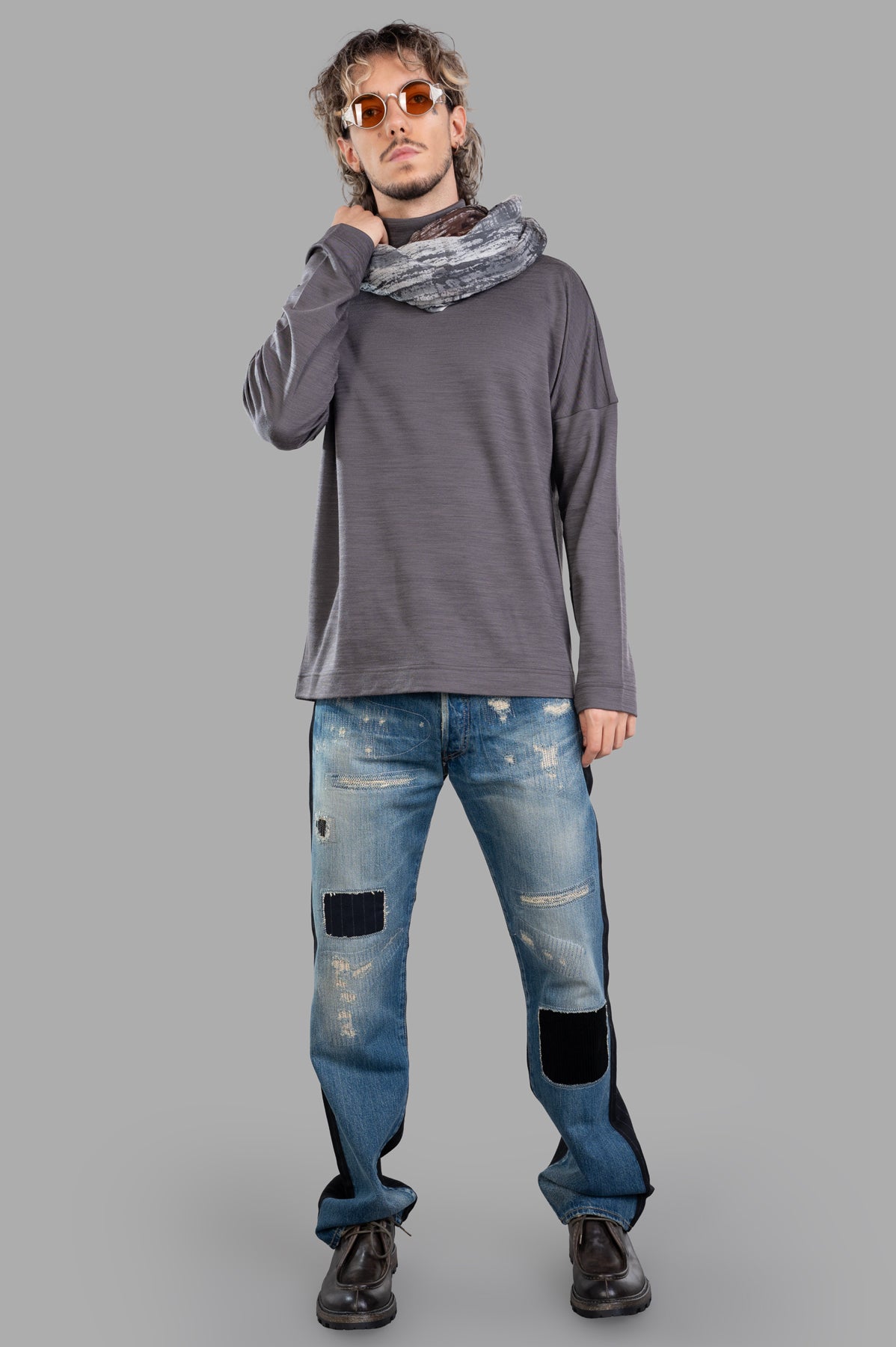 Attachment grey turtleneck top in wool blend, front view on model, paired with jeans, showcasing elegance and comfort.