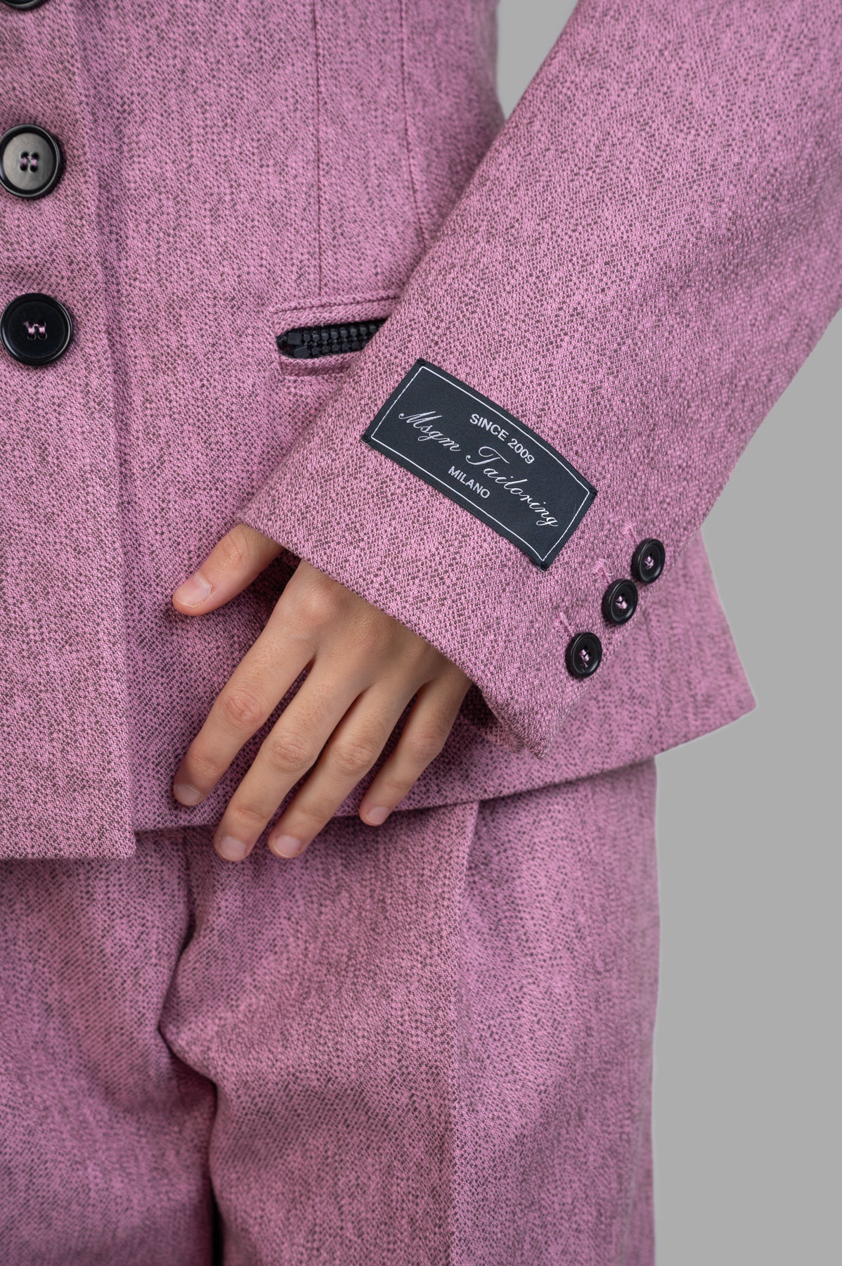 MSGM Single-breasted Blazer detail showing pink gabardine fabric, buttoned cuffs, and stylish inner label.