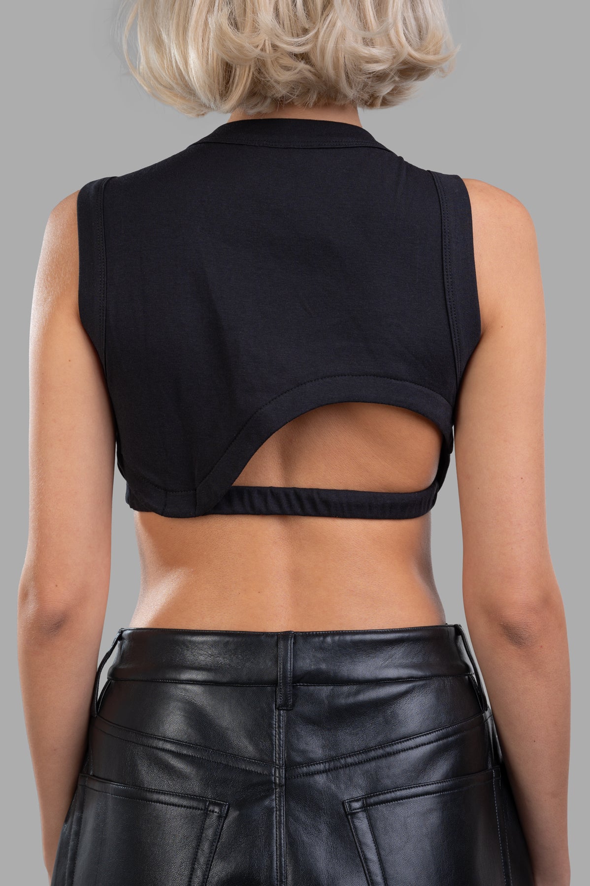 Natasha Zinko Cropped Cutout Top, black, showcasing back view with cutout details and sleek fit. Perfect for stylish outings.