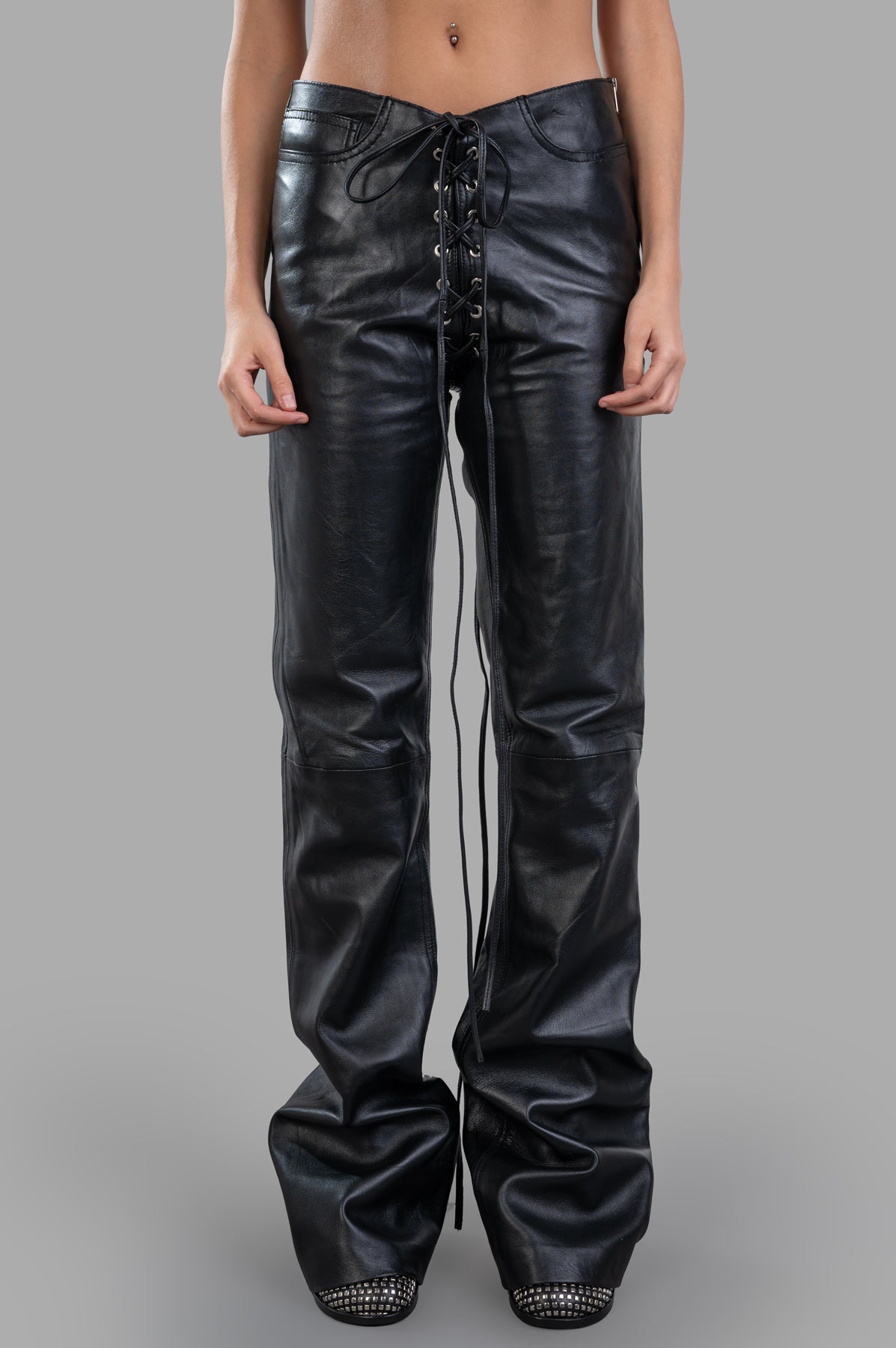 Natasha Zinko Lace-Up Leather Pants showcased from the front, featuring a high-quality black leather finish and detailed.
