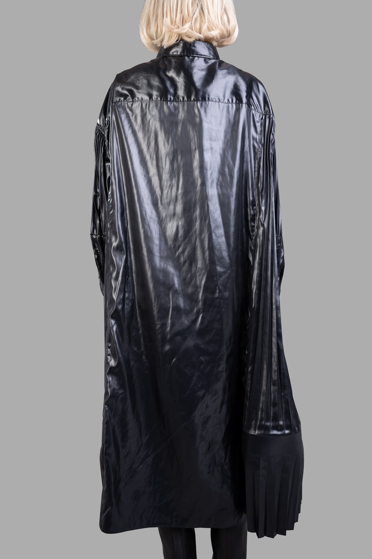 Junya Watanabe Pleated Dress featuring a sleek back view with long puff sleeves and textured pleat detailing in black.